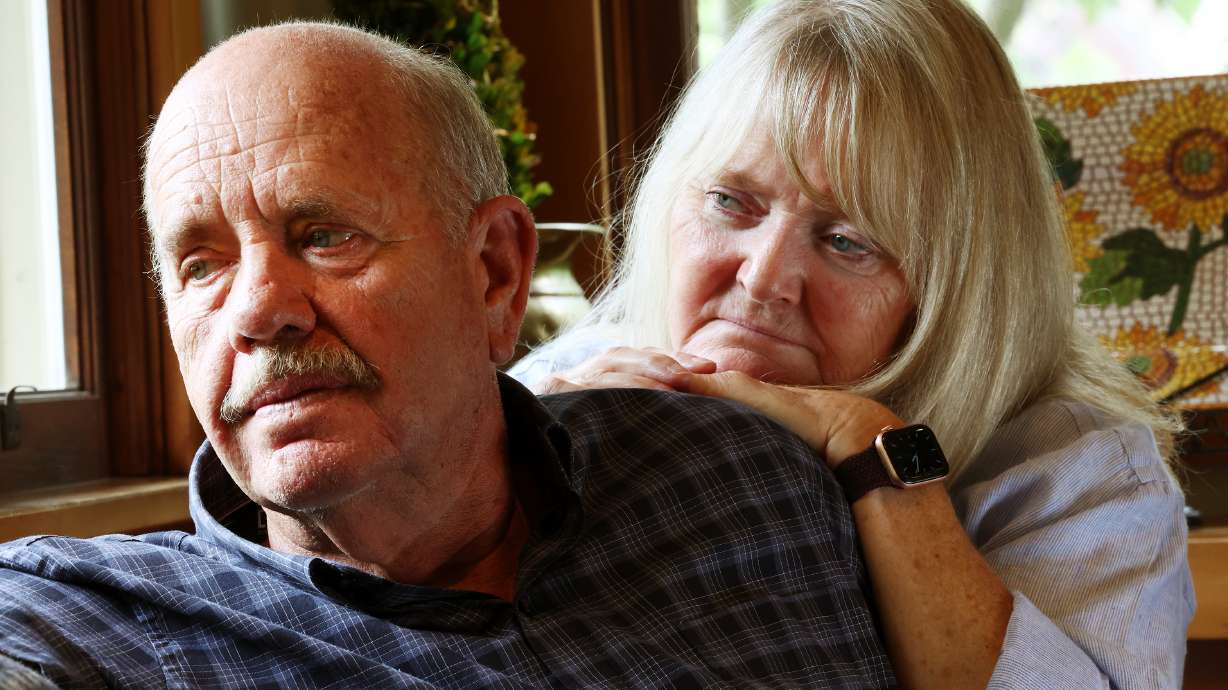 Ron and Sy Snarr, of Salt Lake City, pose for a photo on Friday, Aug. 19, after reading a letter from Jorge Benvenuto, who murdered their son, Zachary Snarr, in August 1996.