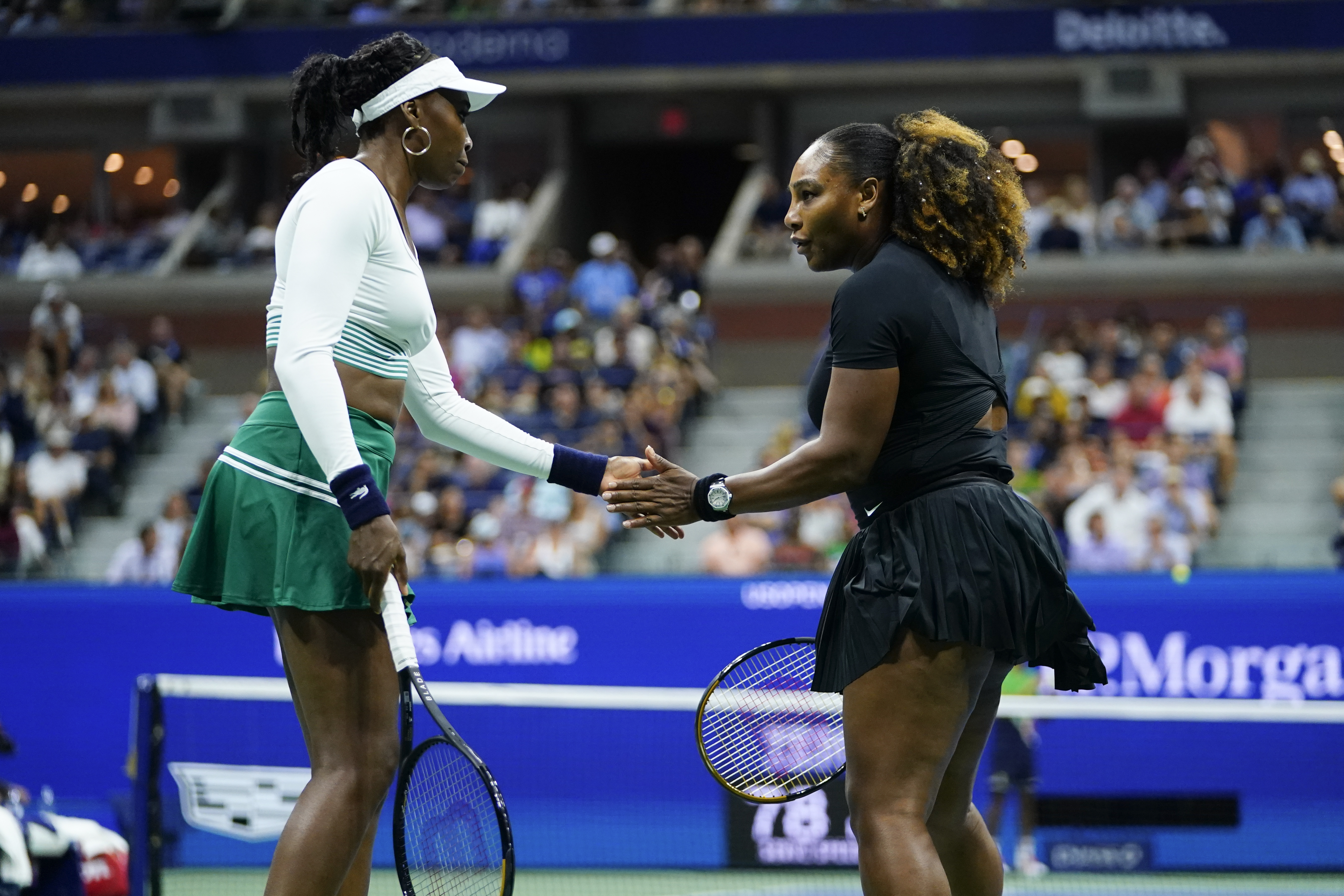 Serena Williams, right, and Venus Williams, of the United States, celebrate during their first-round doubles match against Lucie Hradecká and Linda Nosková, of the Czech Republic, at the U.S. Open tennis championships, Thursday, Sept. 1, 2022, in New York. 