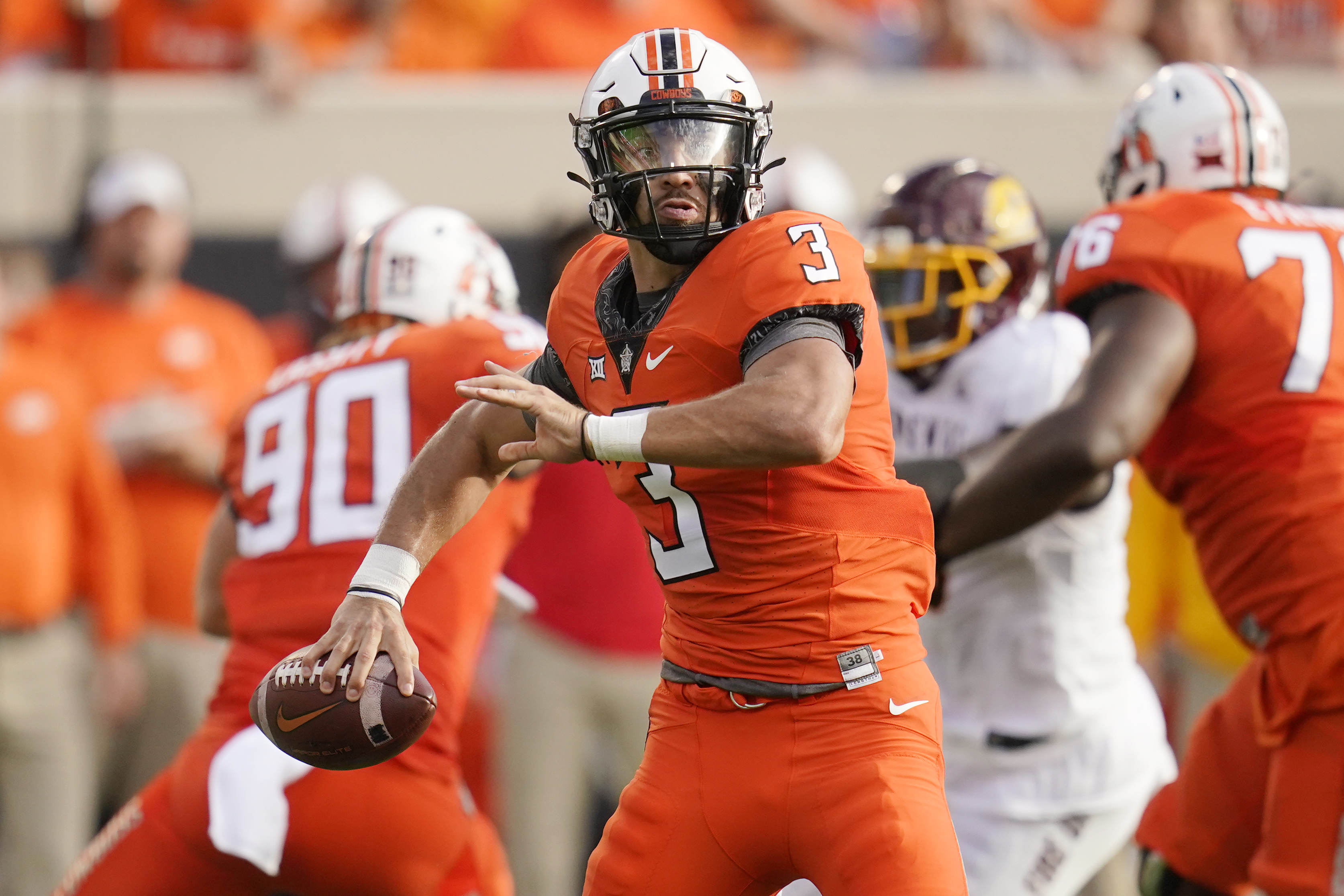 Oklahoma State quarterback Spencer Sanders (3) looks for a receiver during the first half of the team's NCAA college football game against Central Michigan, Thursday, Sept. 1, 2022, in Stillwater, Okla. 