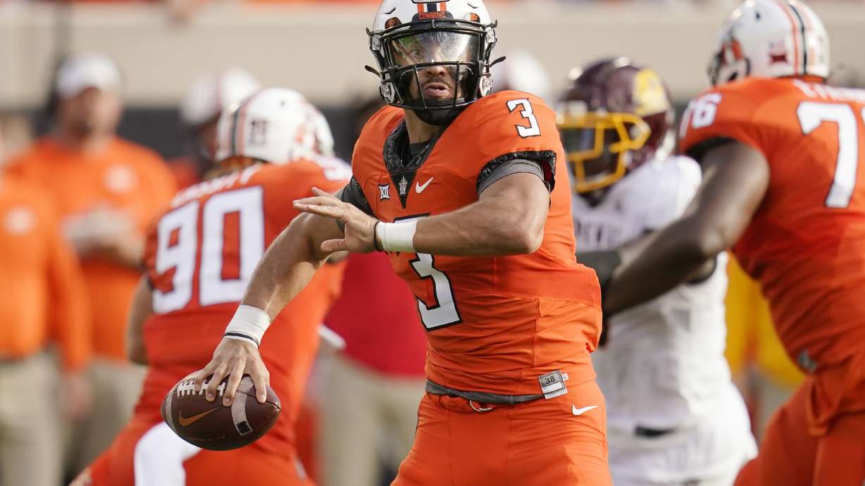 Oklahoma State quarterback Spencer Sanders (3) looks for a receiver during the first half of the team's NCAA college football game against Central Michigan, Thursday, Sept. 1, 2022, in Stillwater, Okla.