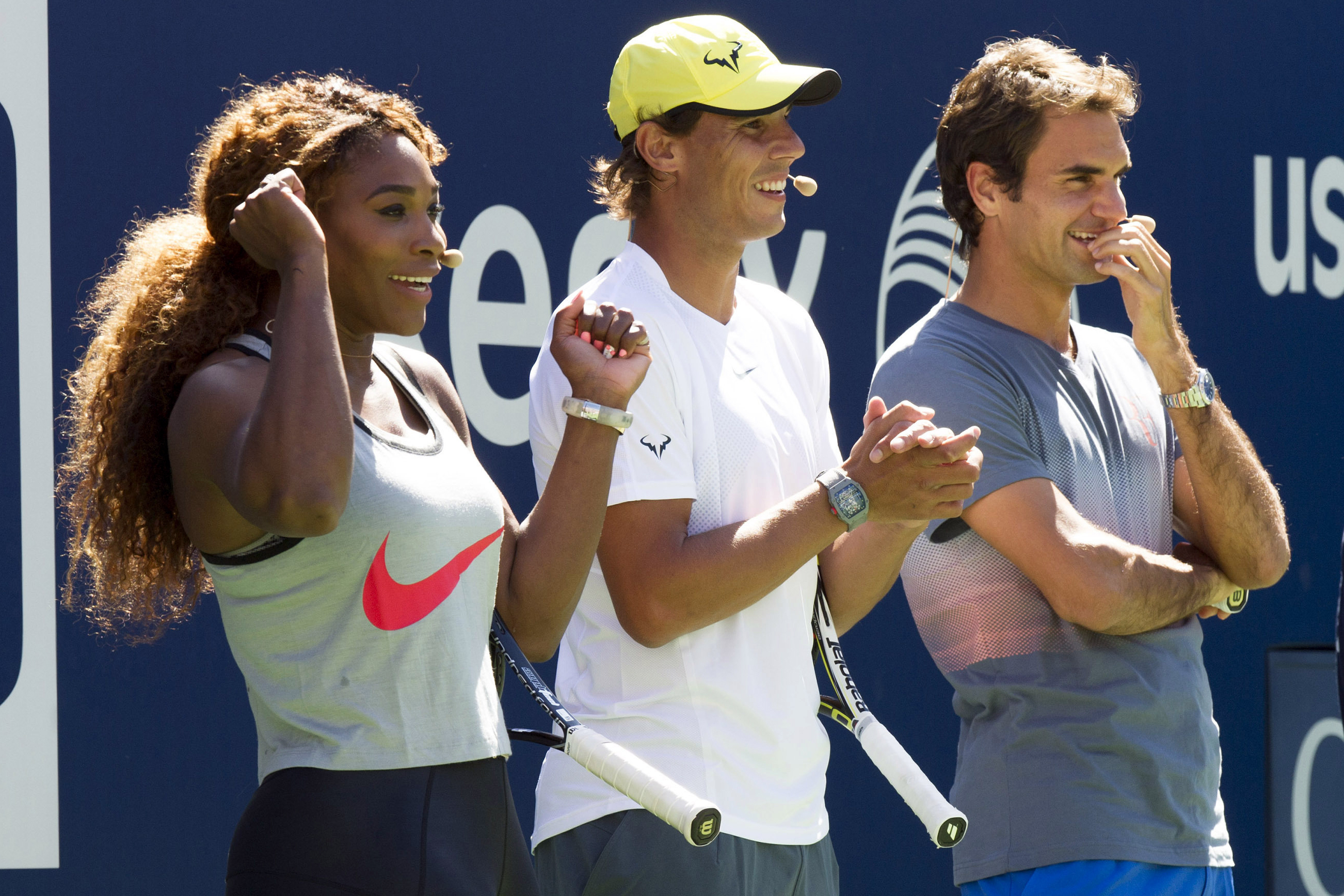 FILE - Serena Williams, Rafael Nadal and Roger Federer, right, cheer on the competition during Arthur Ashe Kids' Day, the kick off to the U.S. Open tennis tournament, Aug. 24, 2013, in New York. Some older fans in particular — middle-aged, or beyond — said they saw in Williams’ latest run at the 2022 U.S. Open a very human and relatable takeaway. Namely the idea that they, also, could perform better and longer than they once thought possible — through fitness, practice and grit.