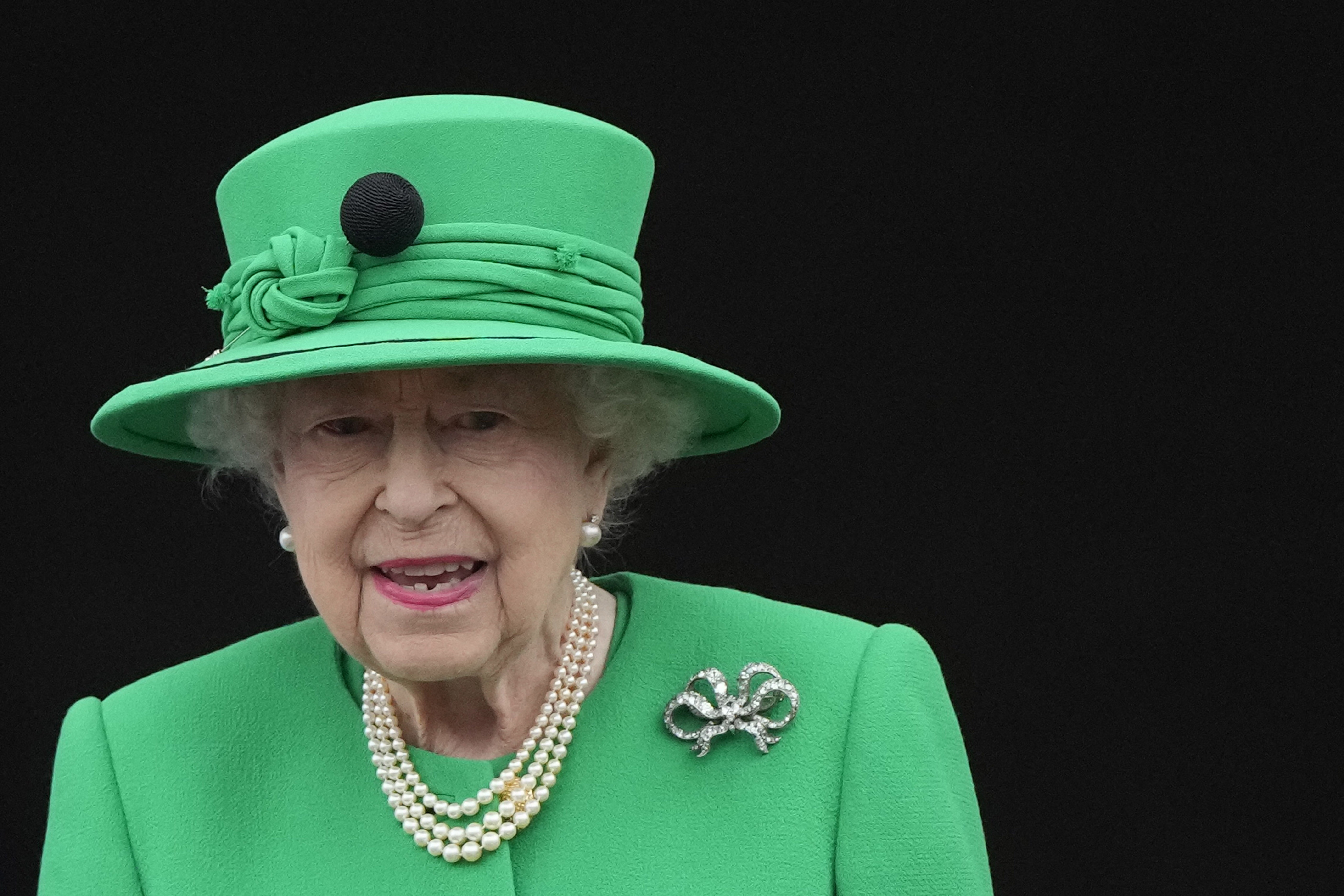 FILE - Queen Elizabeth II stands on the balcony during the Platinum Jubilee Pageant at the Buckingham Palace in London, Sunday, June 5, 2022, on the last of four days of celebrations to mark the Platinum Jubilee. Queen Elizabeth II will skip the Braemar Gathering, a popular Highland Games event, as she struggles with issues getting around. 