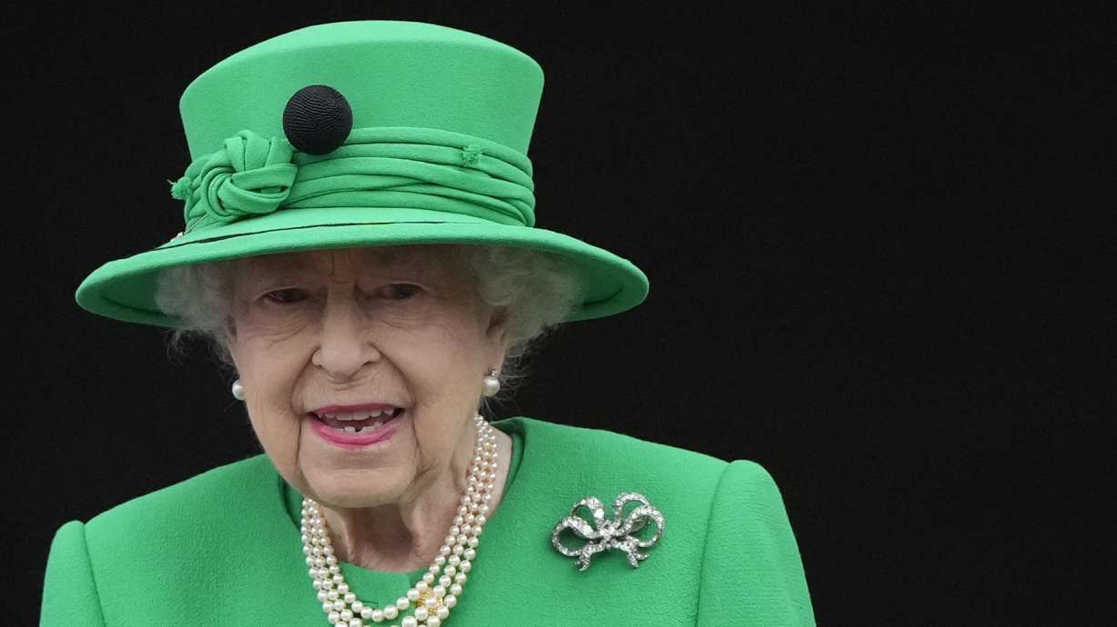 FILE - Queen Elizabeth II stands on the balcony during the Platinum Jubilee Pageant at the Buckingham Palace in London, Sunday, June 5, 2022, on the last of four days of celebrations to mark the Platinum Jubilee. Queen Elizabeth II will skip the Braemar Gathering, a popular Highland Games event, as she struggles with issues getting around.
