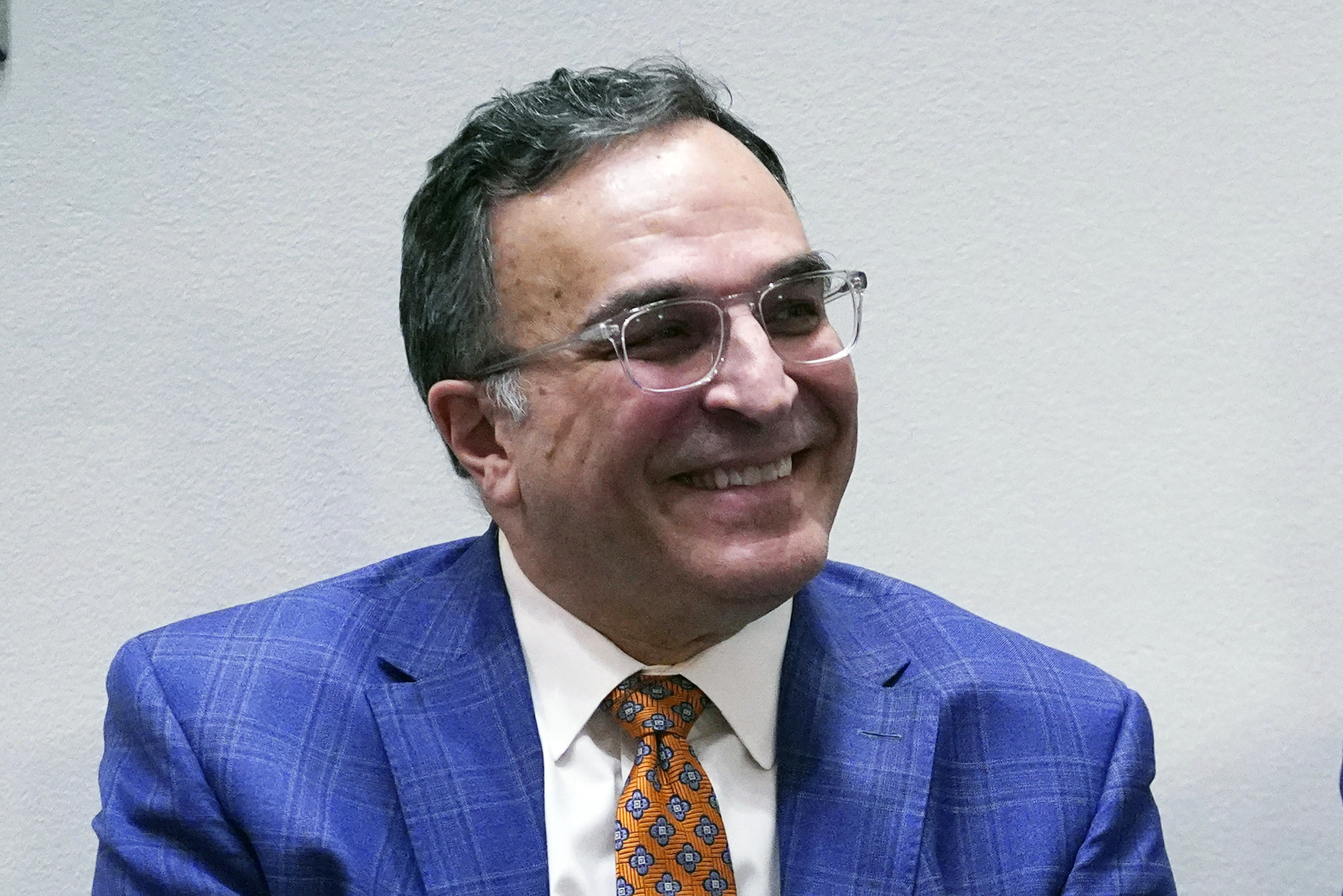 FILE - Chicago Bears NFL football team President and CEO Ted Phillips smiles during a news conference at Halas Hall in Lake Forest, Ill., Monday, Jan. 31, 2022. Chicago Bears president and CEO Ted Phillips will retire at the end of the season after nearly 40 years with the franchise, the team announced on Friday, Sept. 2, 2022. 