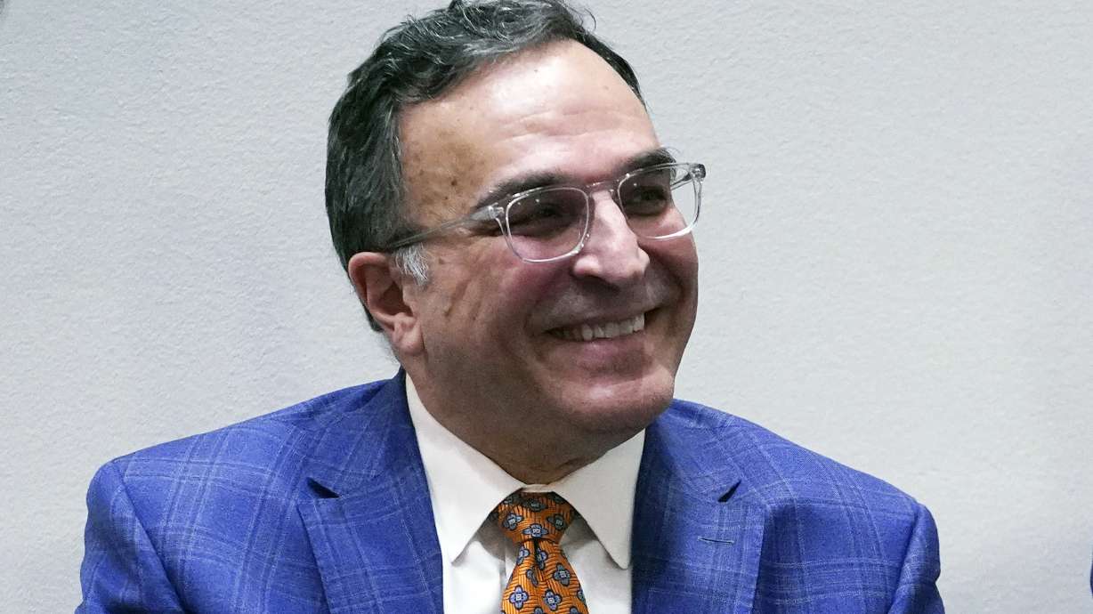 FILE - Chicago Bears NFL football team President and CEO Ted Phillips smiles during a news conference at Halas Hall in Lake Forest, Ill., Monday, Jan. 31, 2022. Chicago Bears president and CEO Ted Phillips will retire at the end of the season after nearly 40 years with the franchise, the team announced on Friday, Sept. 2, 2022.