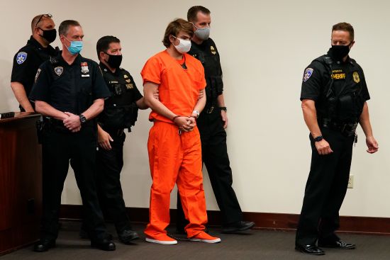 Payton Gendron is led into the courtroom for a hearing at Erie County Court, in Buffalo, N.Y., May 19. Gendron was a 17-year-old high school senior in 2021 when he was investigated by New York’s State Police and ordered hospitalized for a mental health evaluation for typing into an economics class online program that his future plans included “murder-suicide.” But since he was a minor, he wasn’t covered under the state’s red flag law.