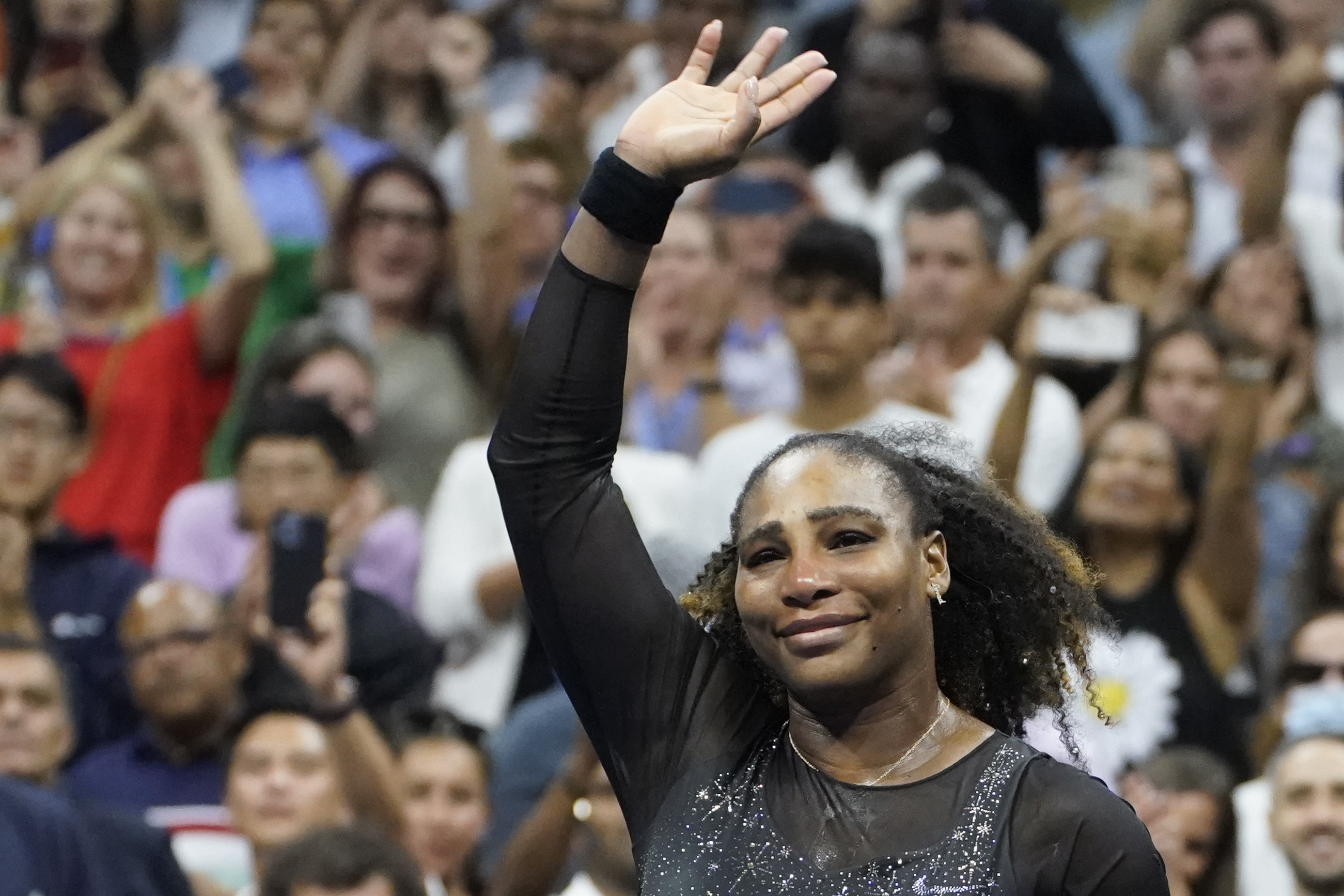 Serena Williams, of the United States, waves to fans after losing to Ajla Tomljanovic, of Austrailia, in the third round of the U.S. Open tennis championships, Friday, Sept. 2, 2022, in New York. 