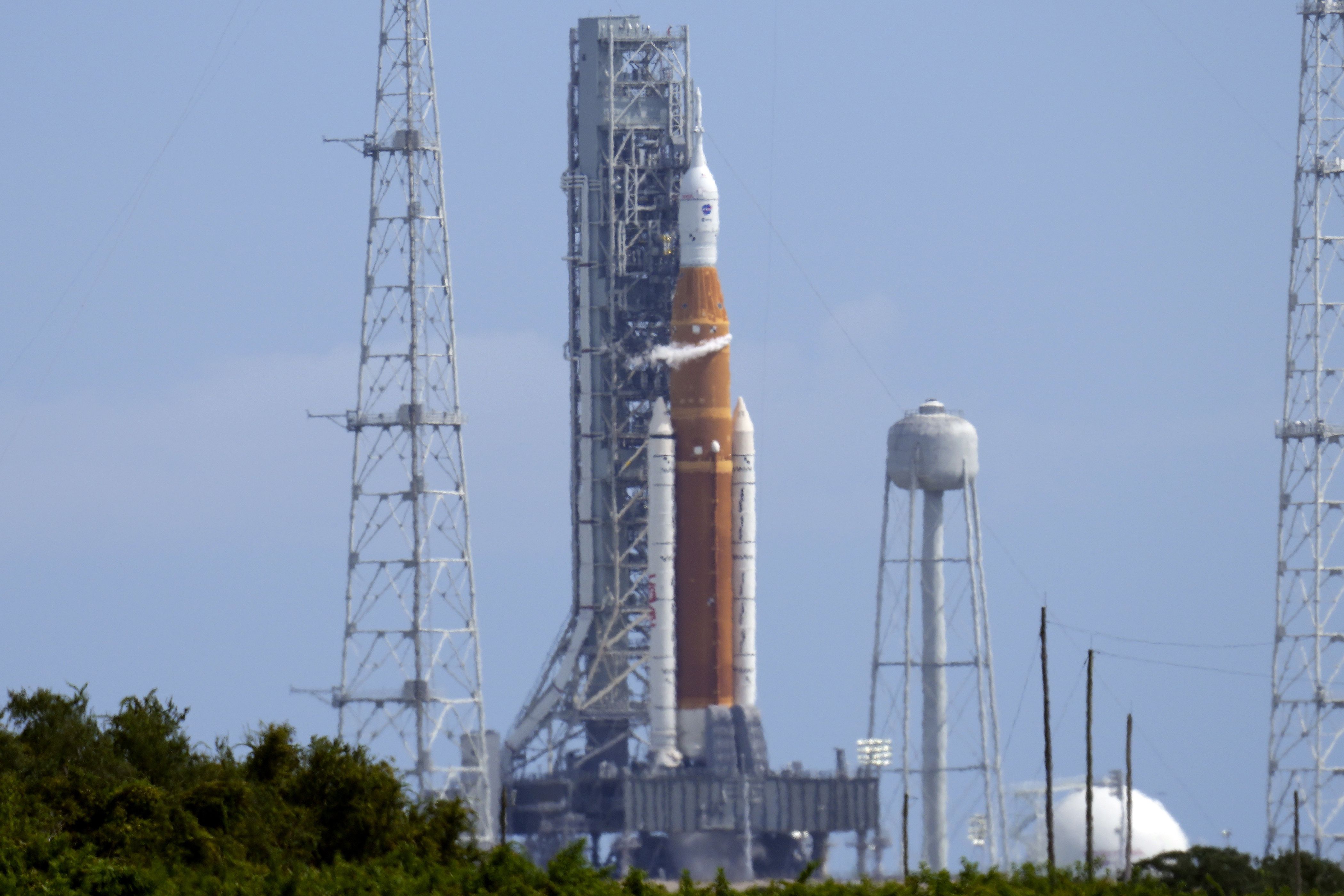 NASA’s new moon rocket sits on Launch Pad 39-B moments after the launch attempt was scrubbed at the Kennedy Space Center Saturday, in Cape Canaveral, Fla.