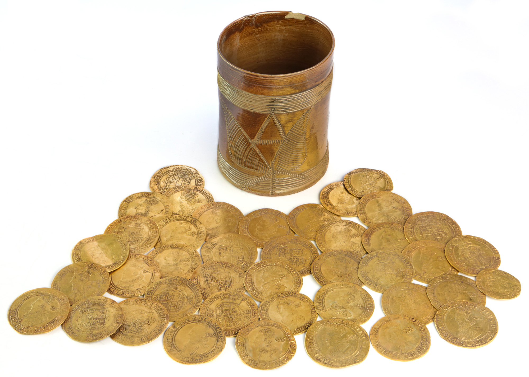 The discovery of more than 260 gold coins dating back to the 17th and 18th centuries is "one of the largest on archaeological record from Britain," according to auctioneers Spink and Son.
