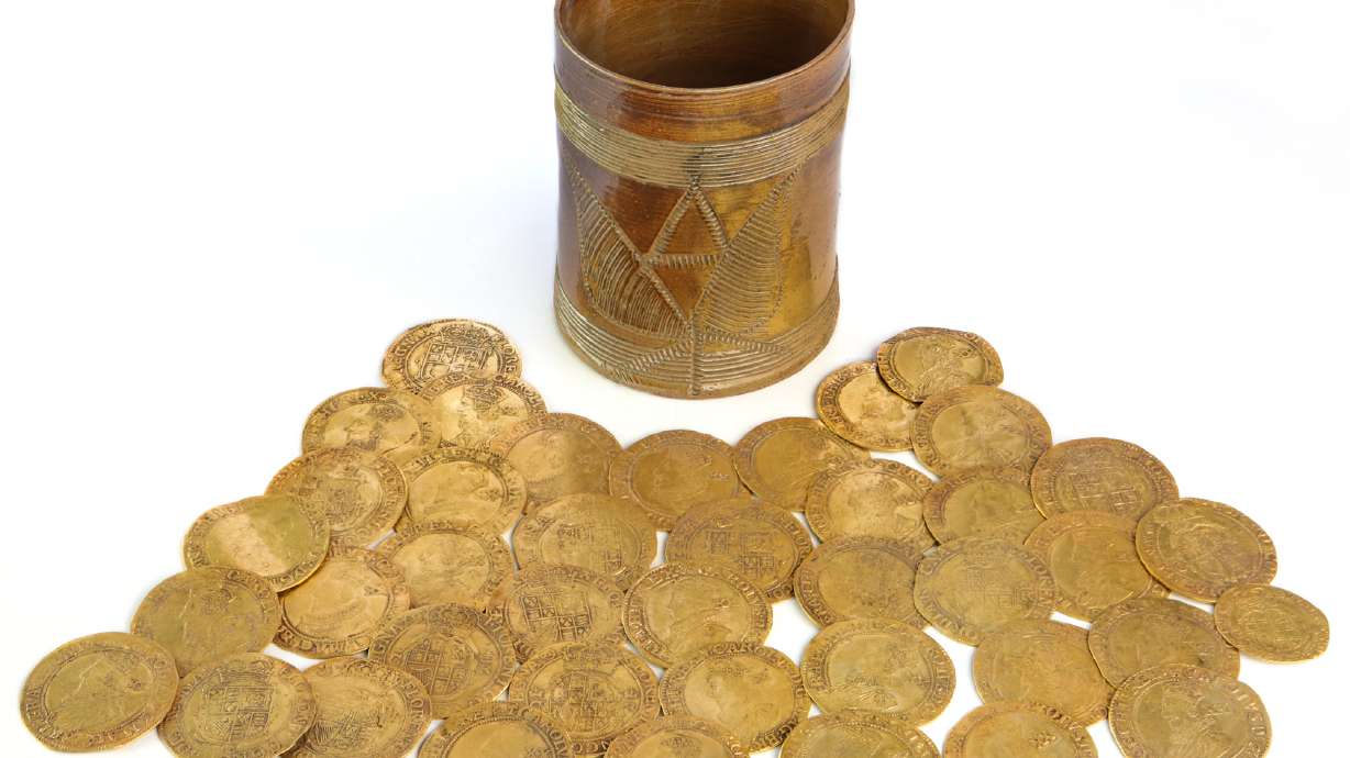 The discovery of more than 260 gold coins dating back to the 17th and 18th centuries is "one of the largest on archaeological record from Britain," according to auctioneers Spink and Son.