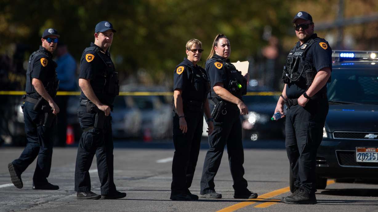 Officers work during an investigation on 100 South, where a shooting left one dead in Salt Lake City on Sept. 3, 2022. One of three men charged in that shooting was sentenced to prison on Wednesday.