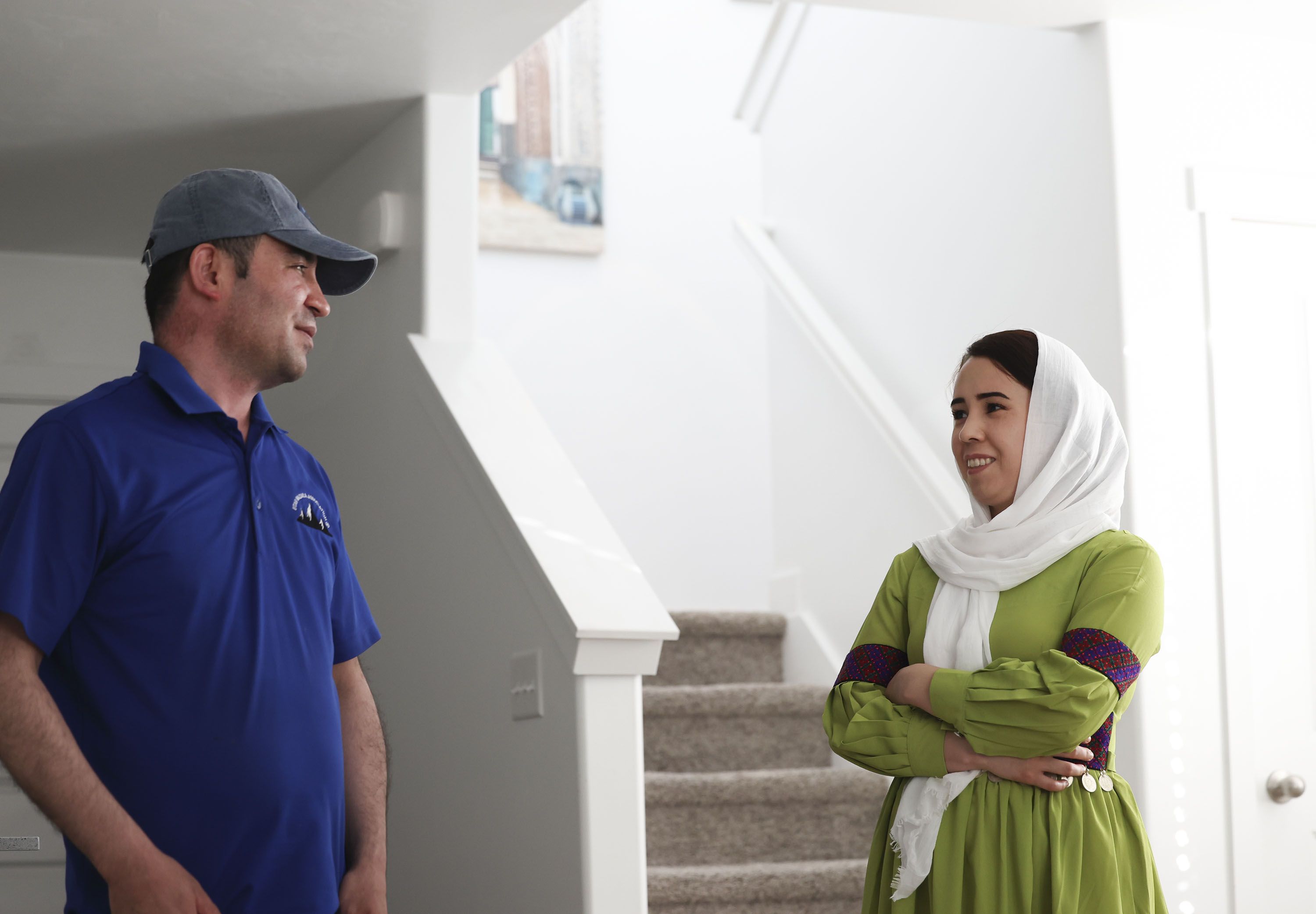 Abdul and his wife, Nazdanah, are pictured in their Herriman home on Wednesday. Nazdanah recently arrived in Utah after being stuck in Afghanistan for almost a year.