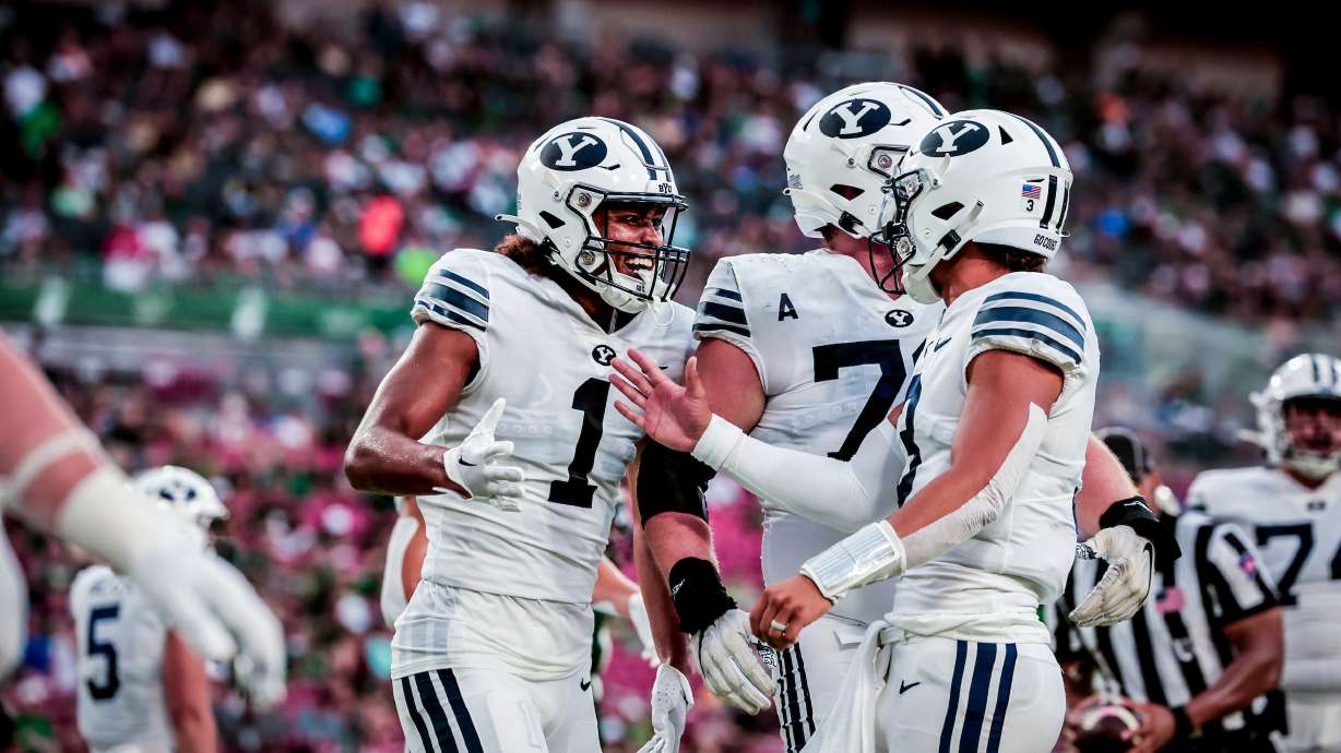 BYU wide receiver Keanu Hill celebrates a touchdown with quarterback Jaren Hall during the Cougars' game against South Florida, Saturday, Sept. 3, 2022 in Tampa, Fla.