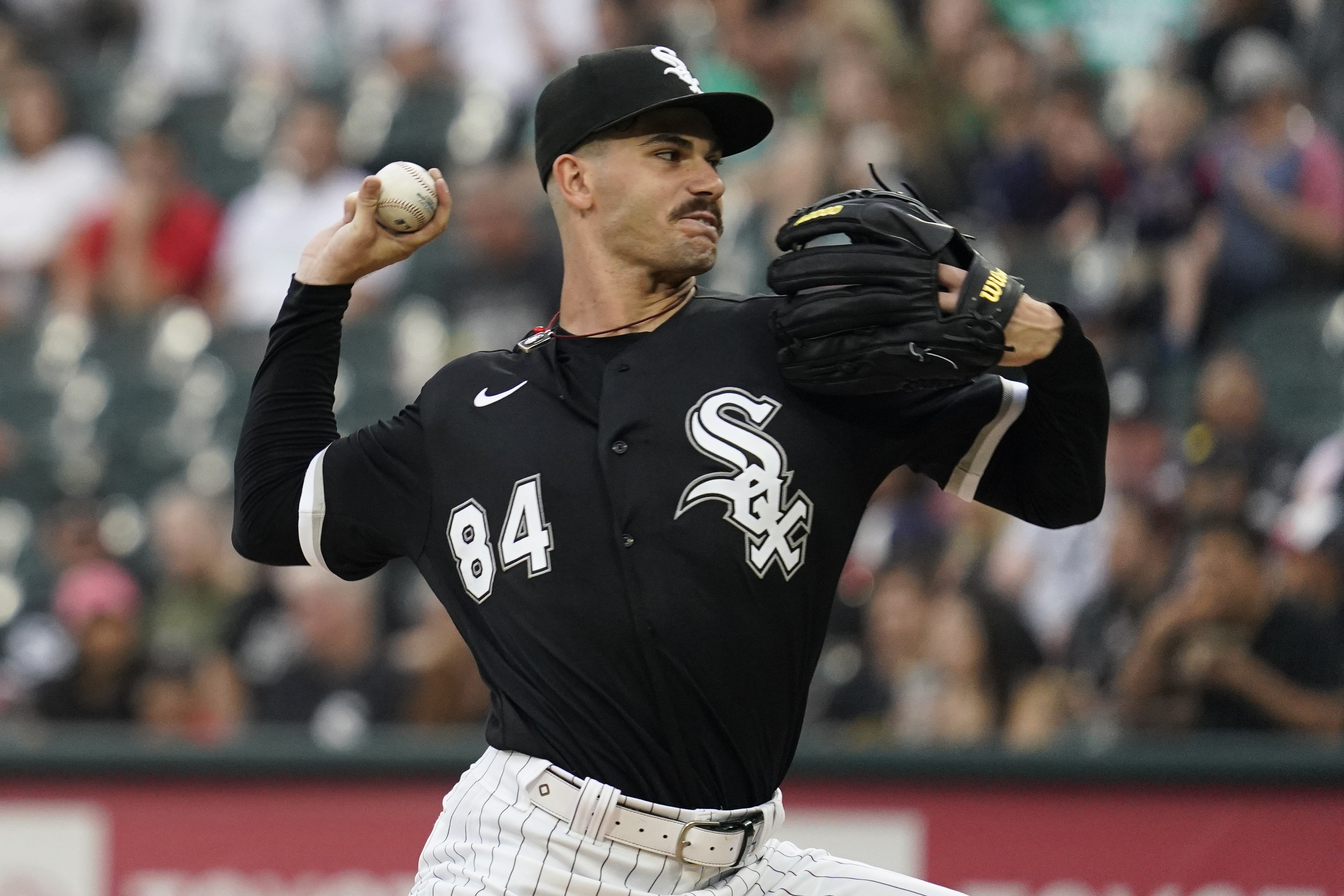 Chicago White Sox starting pitcher Dylan Cease throws against the Minnesota Twins during the first inning of a baseball game in Chicago, Saturday, Sept. 3, 2022. 