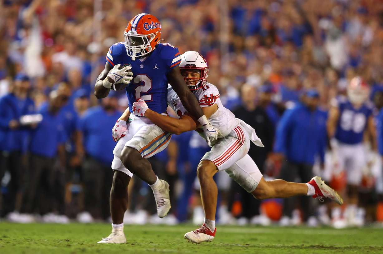 Florida Gators running back Montrell Johnson Jr. (2) is tackled by Utah Utes safety R.J. Hubert (11) as Utah and Florida play in Gainesville, Fla., on Saturday, Sept. 3, 2022. Florida won 29-26.