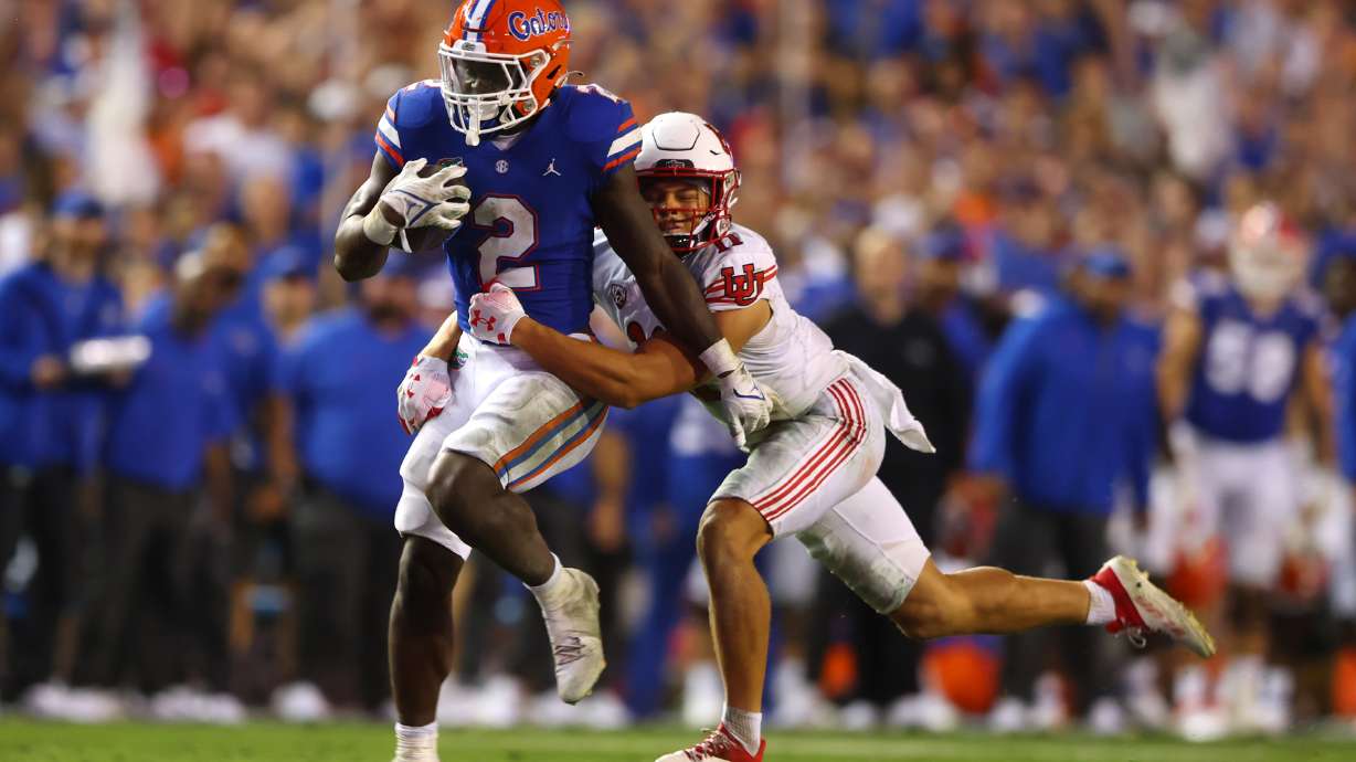 Florida Gators running back Montrell Johnson Jr. (2) is tackled by Utah Utes safety R.J. Hubert (11) as Utah and Florida play in Gainesville, Fla., on Saturday, Sept. 3, 2022. Florida won 29-26.
