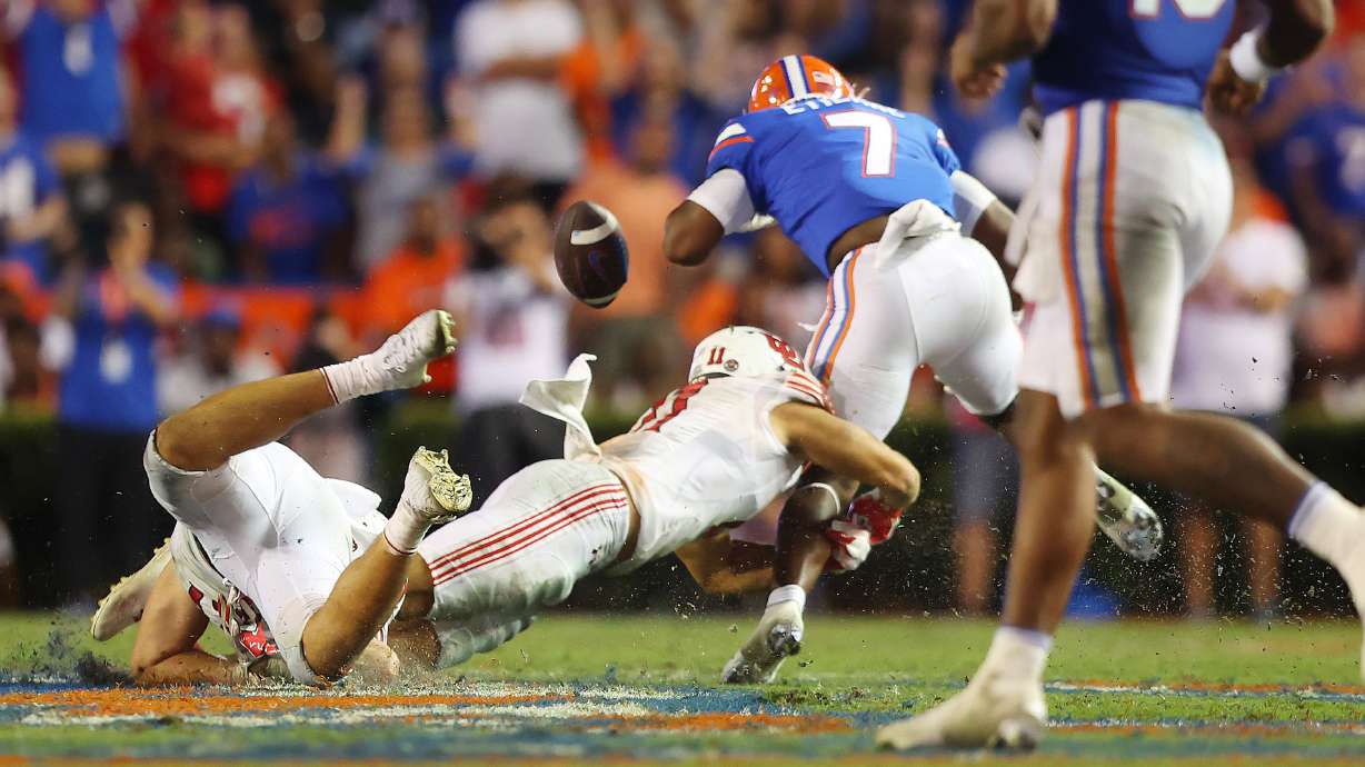 Utah Utes safety R.J. Hubert (11) causes a fumble as he tackles Florida Gators running back Trevor Etienne (7) as Utah and Florida play in Gainesville, Fla., on Saturday, Sept. 3, 2022. Florida won 29-26.