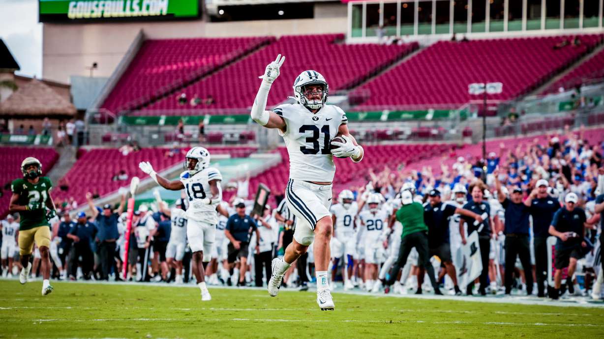 BYU linebacker Max Tooley returns an interception against South Florida, Saturday, Sept. 3, 2022 at Raymond James Stadium in Tampa, Fla.