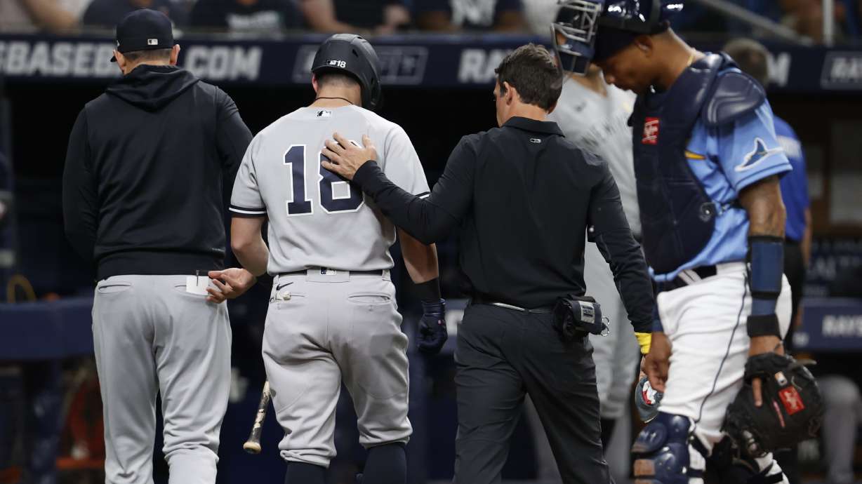 New York Yankees' Andrew Benintendi, who was batting, leaves the team's baseball game against the Tampa Bay Rays during the third inning Friday, Sept. 2, 2022, in St. Petersburg, Fla.