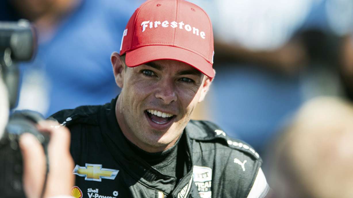 Scott McLaughlin smiles after his victory at the Grand Prix of Portland IndyCar auto race at the Portland International Raceway in Portland, Ore., on Sunday, Sept. 4, 2022.