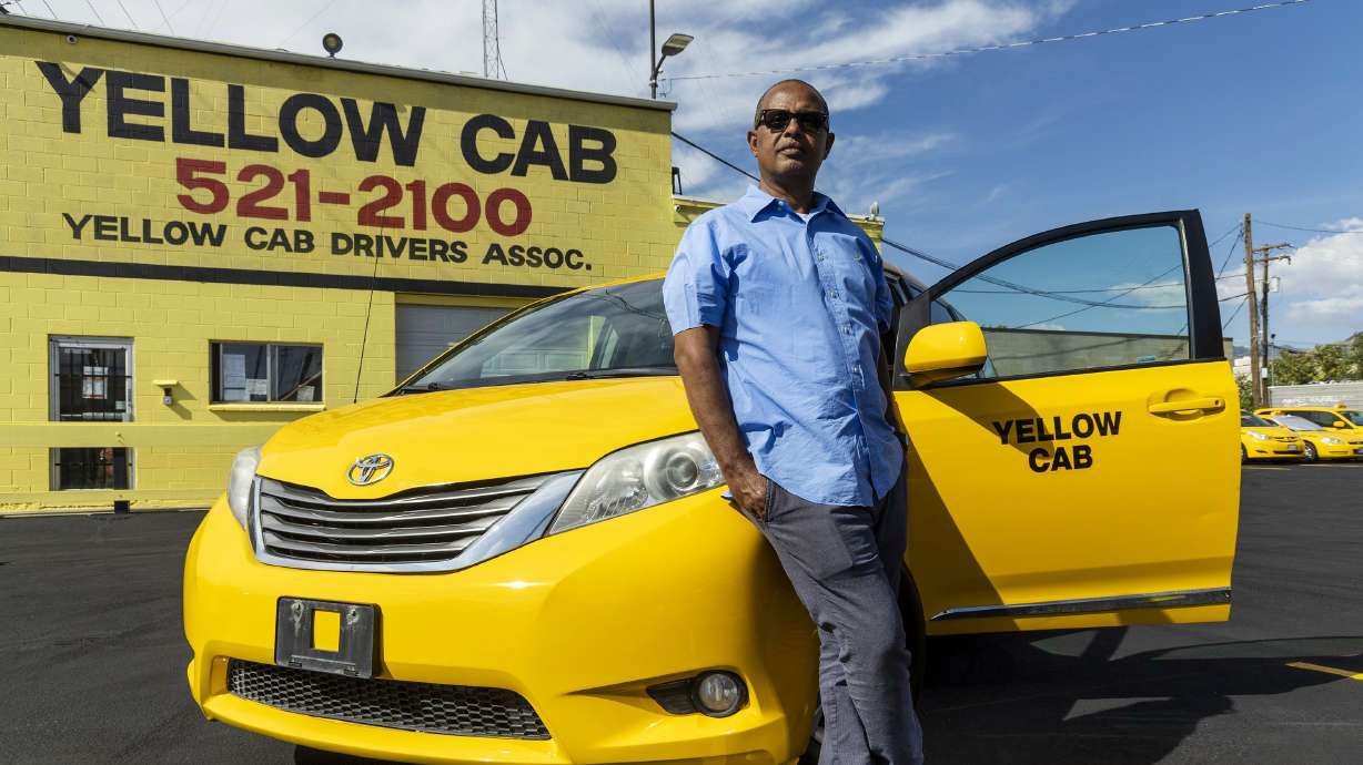 Almoh Bahaji, owner of Yellow Cab in Salt Lake City, poses for photos at his offices on Aug. 10.