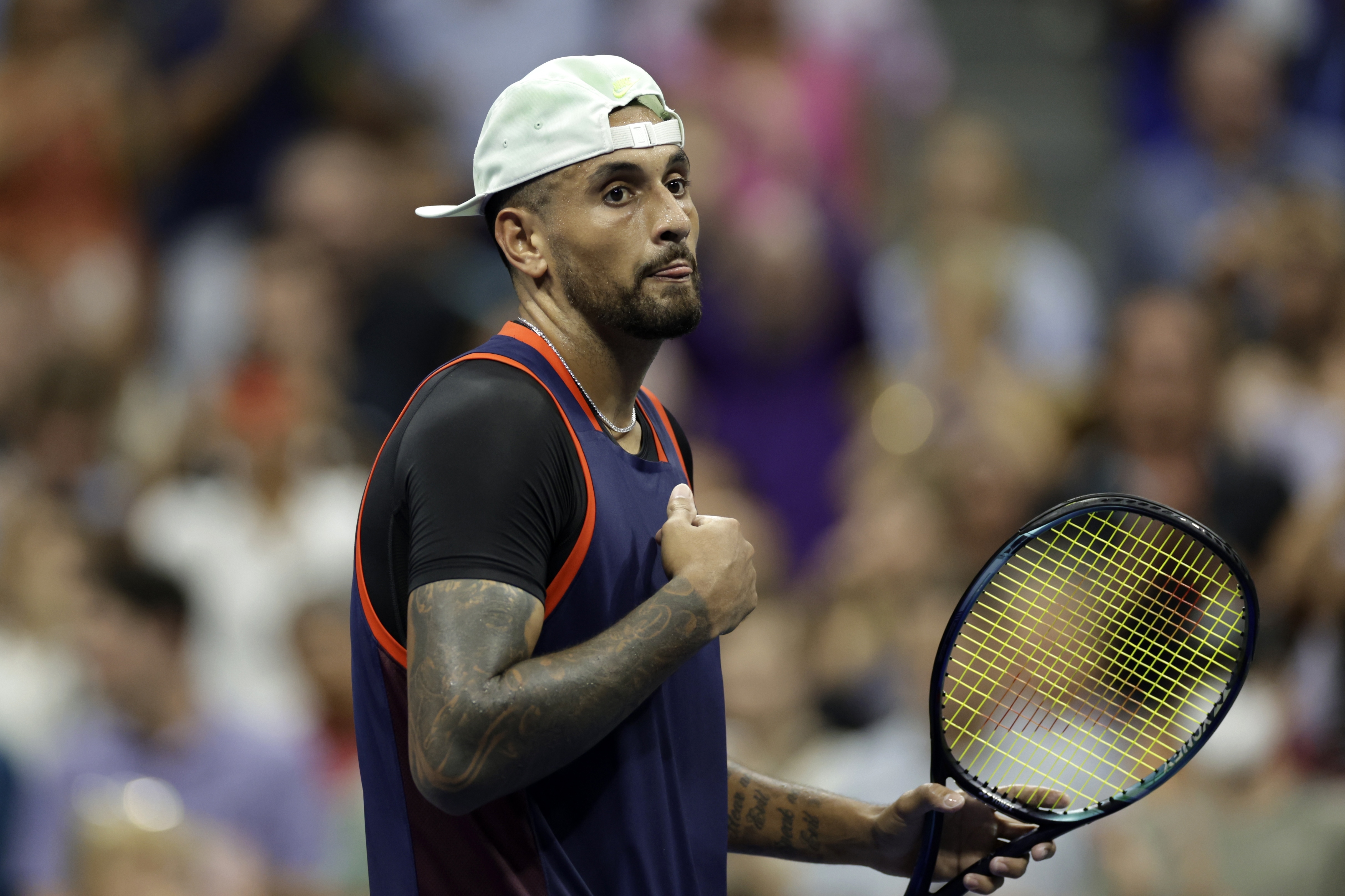 Nick Kyrgios, of Australia, walks across the court after winning his match against Daniil Medvedev, of Russia, during the fourth round of the U.S. Open tennis championships, Sunday, Sept. 4, 2022, in New York. 