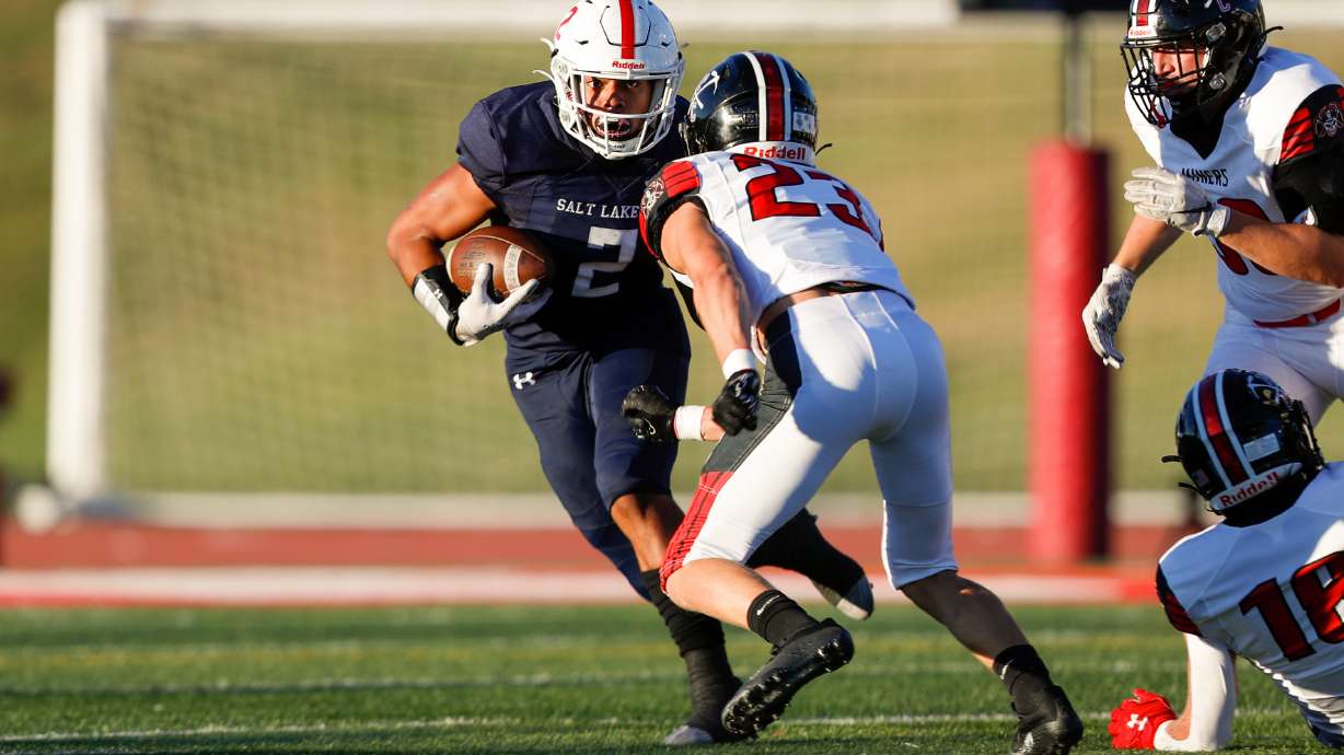 Amini Amone (2) of the East Leopards runs with the ball while playing against the Park City Miners in Salt Lake City on Friday, Sept. 2, 2022. The Leopards won 21-14.