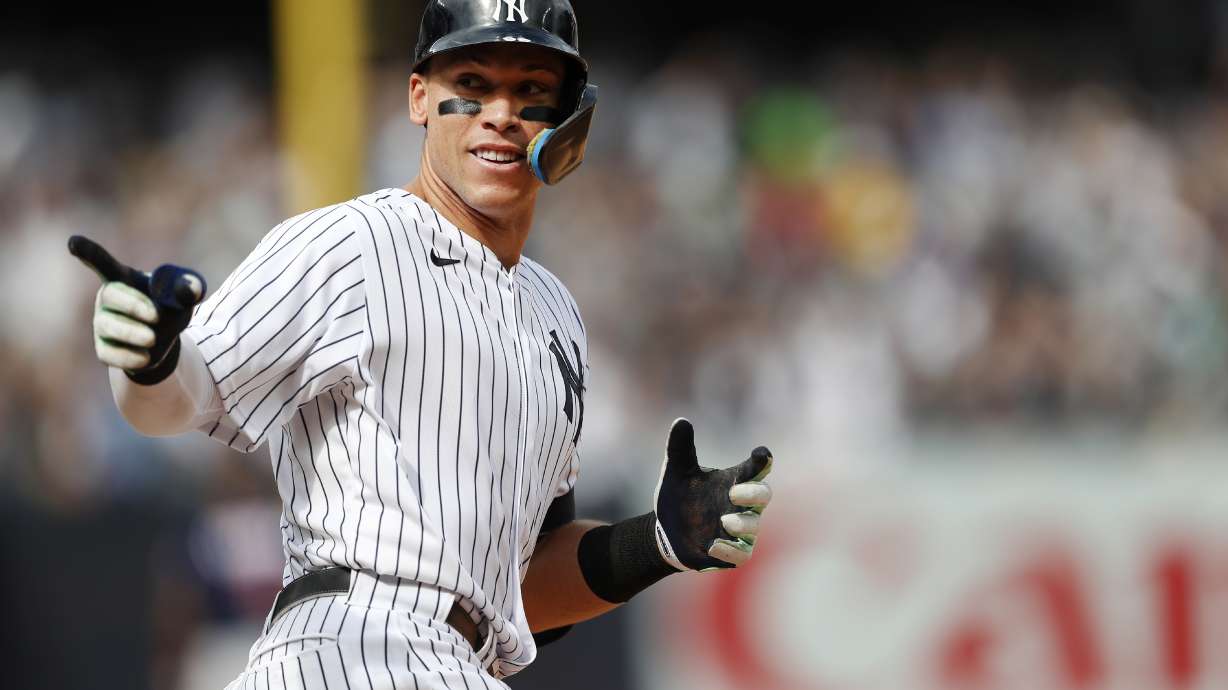 New York Yankees right fielder Aaron Judge (99) reacts while rounding the bases after hitting a home run against the Minnesota Twins during the sixth inning of a baseball game Monday, Sept. 5, 2022, in New York.
