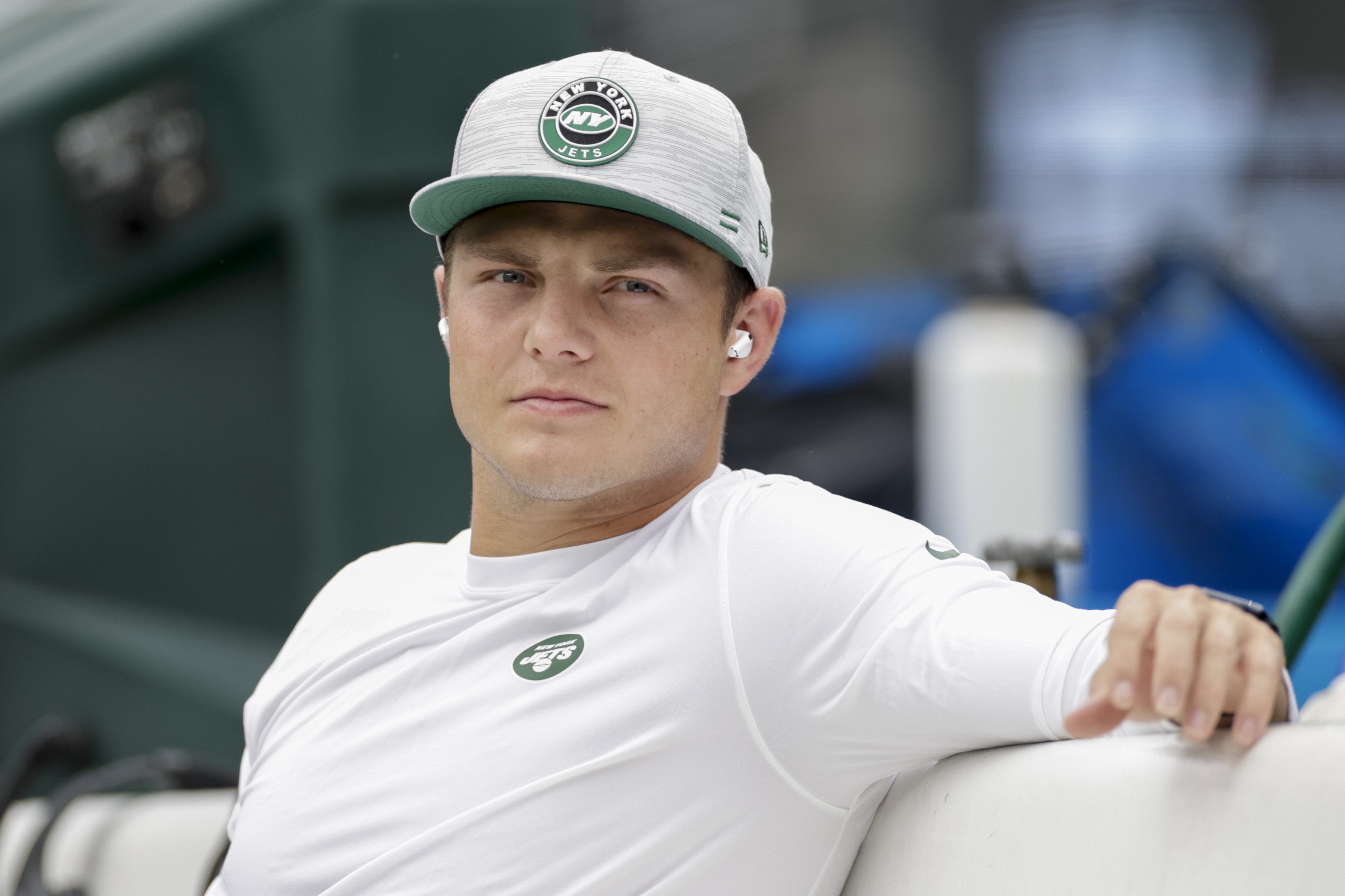New York Jets quarterback Zach Wilson sits on the bench during practice before a preseason NFL football game against the New York Giants, Sunday, Aug. 28, 2022, in East Rutherford, N.J. 