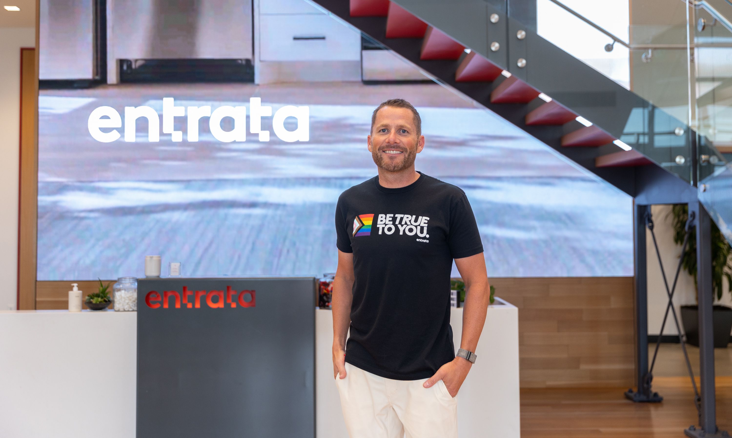 Adam Edmunds, CEO of Entrata, poses for a photo in the lobby of the company’s headquarters in Lehi on Aug. 12.