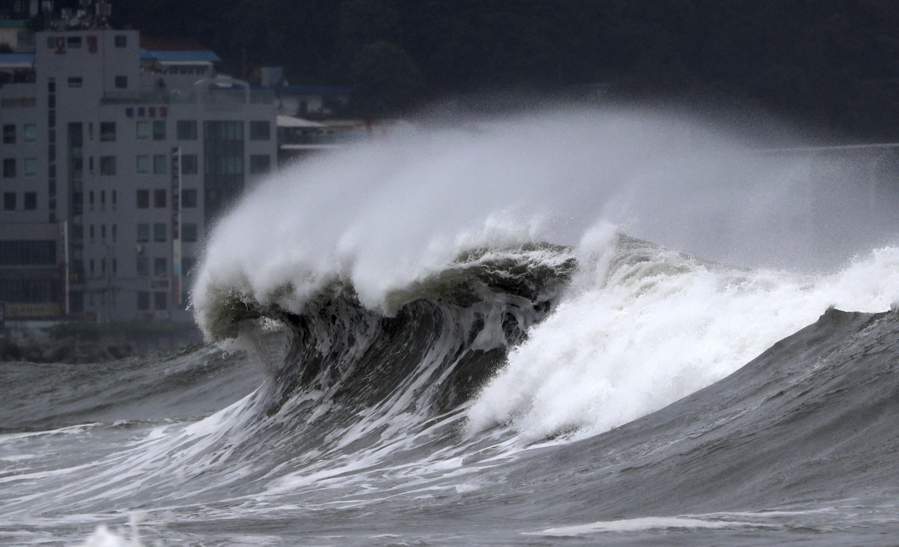 High waves crash onto a beach in Busan, South Korea, as Typhoon Hinnamnor approaches the Korean Peninsula on Monday. 