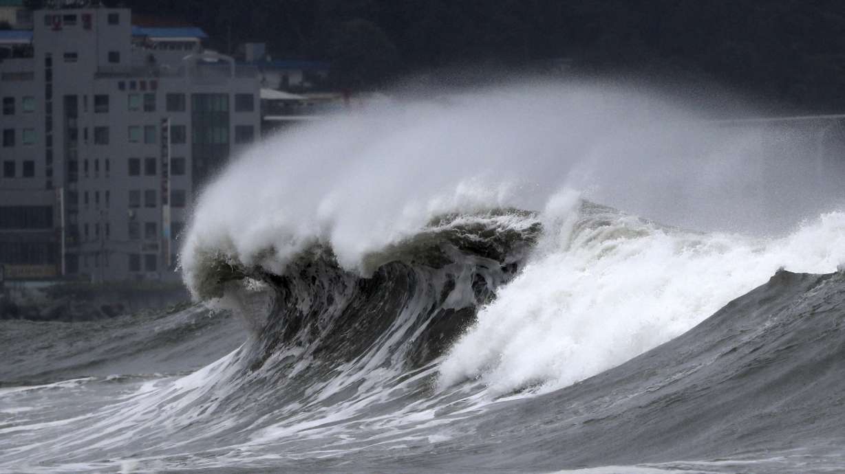 High waves crash onto a beach in Busan, South Korea, as Typhoon Hinnamnor approaches the Korean Peninsula on Monday.