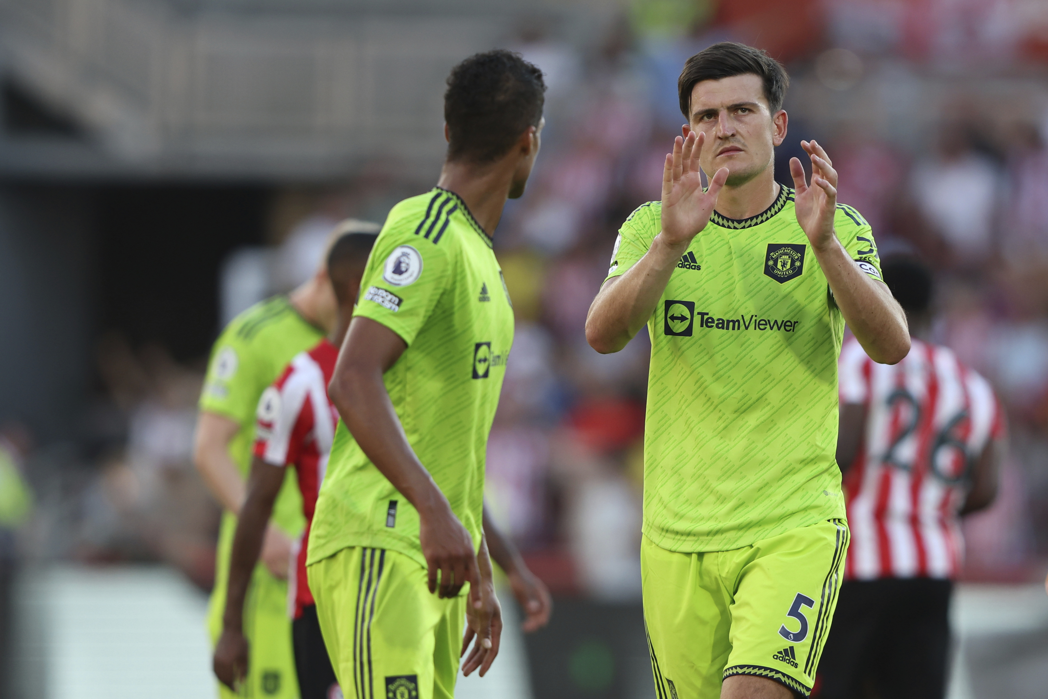 Manchester United's Harry Maguire waves to his team supporters after the end of the English Premier League soccer match between Brentford and Manchester United at the Gtech Community Stadium in London, Saturday, Aug. 13, 2022. Manchester United lost 0-4 .