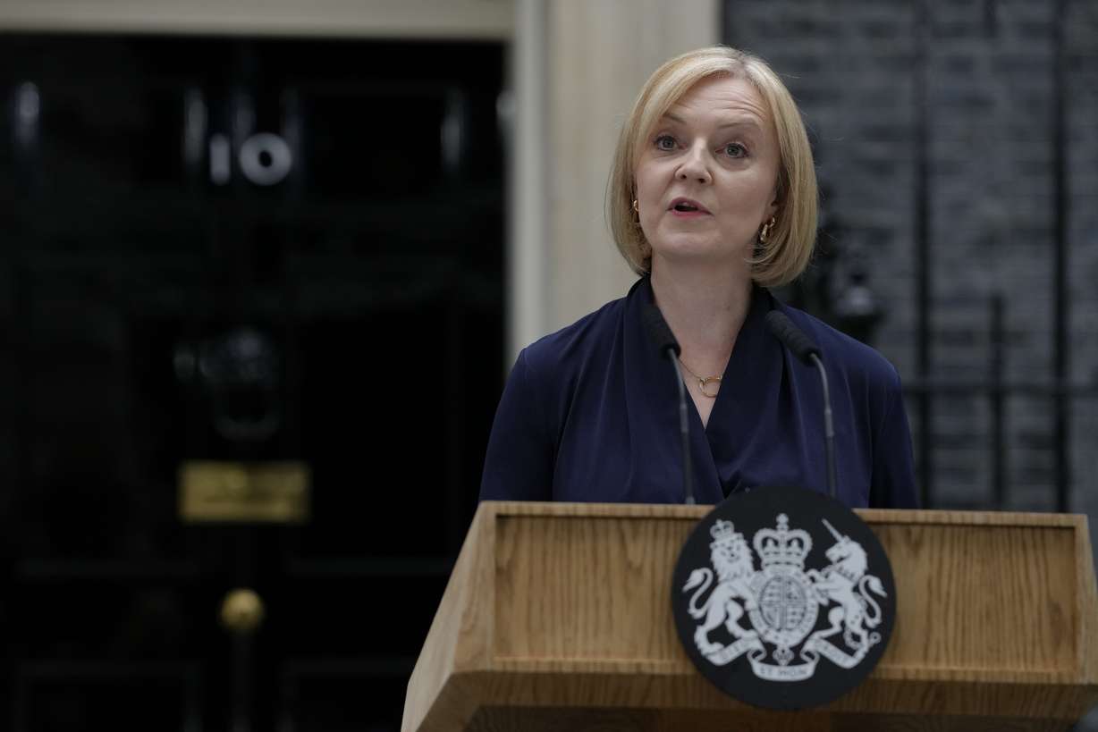 New British Prime Minister Liz Truss makes an address outside Downing Street in London, Tuesday after returning from Balmoral in Scotland where she was formally appointed by Britain's Queen Elizabeth II.