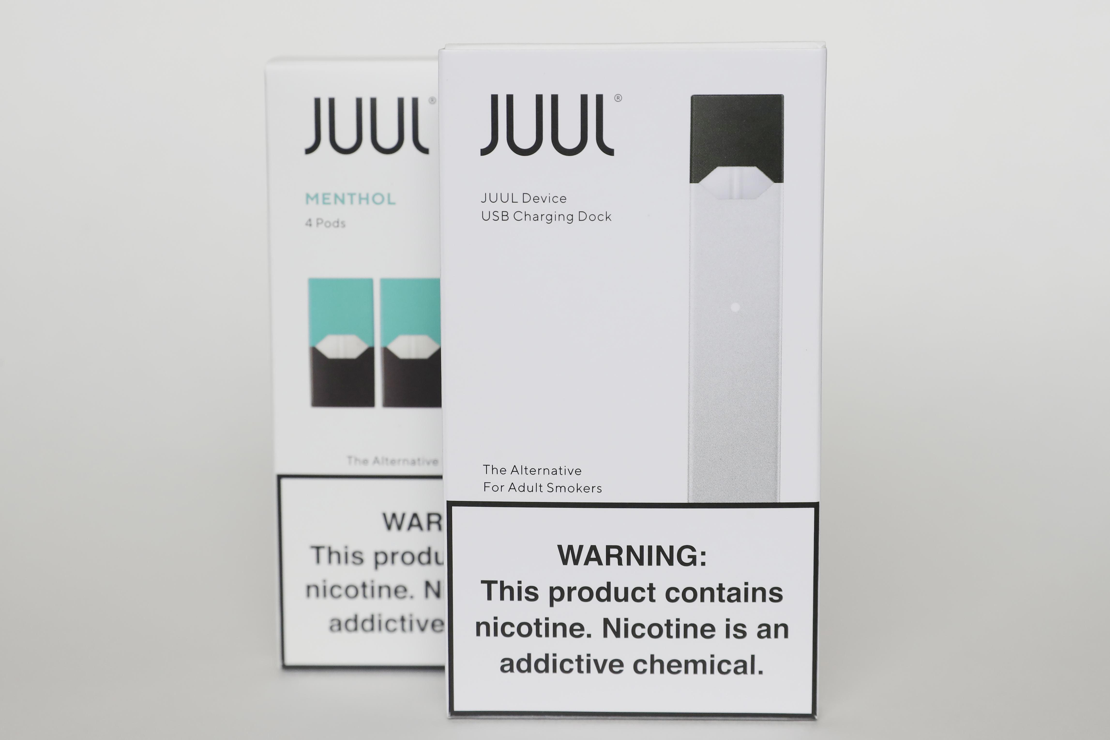 Packaging for an electronic cigarette and menthol pods from Juul Labs is displayed on Feb. 25, 2020, in Pembroke Pines, Fla. In a deal announced Tuesday, Juul Labs will pay nearly $440 million to settle a two-year investigation by 33 states into the marketing of its high-nicotine vaping products, which have long been blamed for sparking a national surge in teen vaping.
