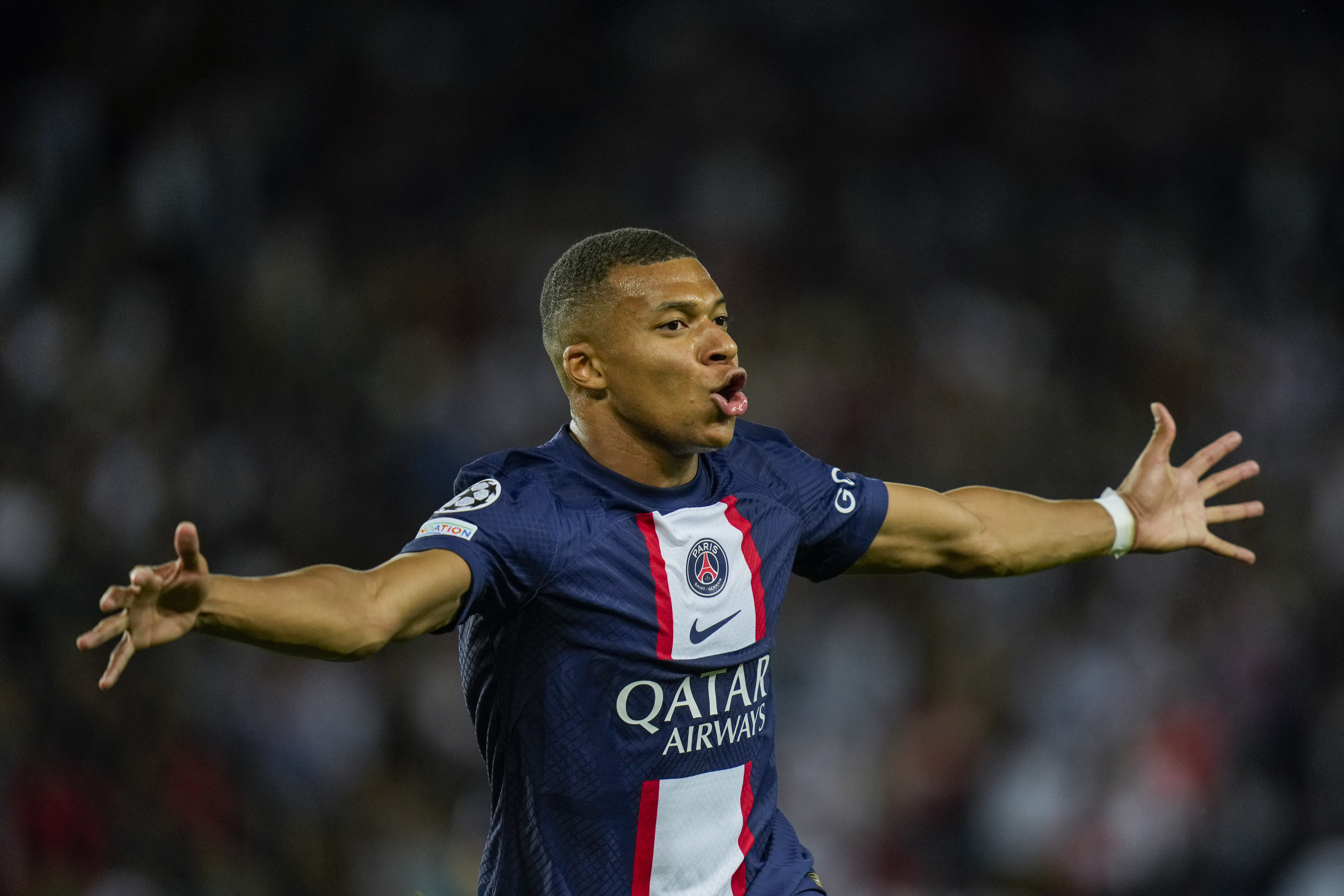 PSG's Kylian Mbappe celebrates after scoring his second goal during the Champions League soccer match Group H against Juventus at the Parc des Princes stadium, in Paris, Tuesday, Sept. 6, 2022.