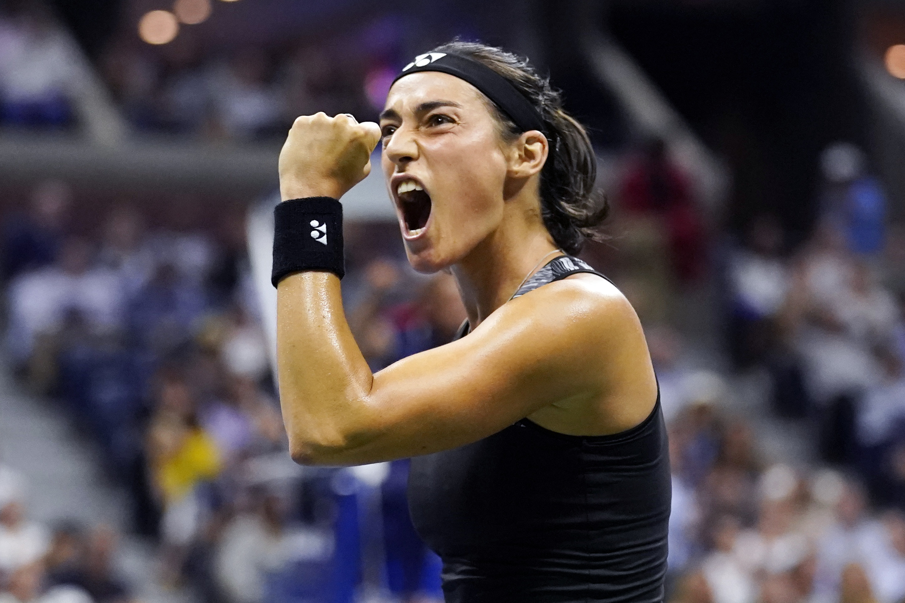 Caroline Garcia, of France, celebrates after winning a point against Coco Gauff, of the United States, during the quarterfinals of the U.S. Open tennis championships, Tuesday, Sept. 6, 2022, in New York.
