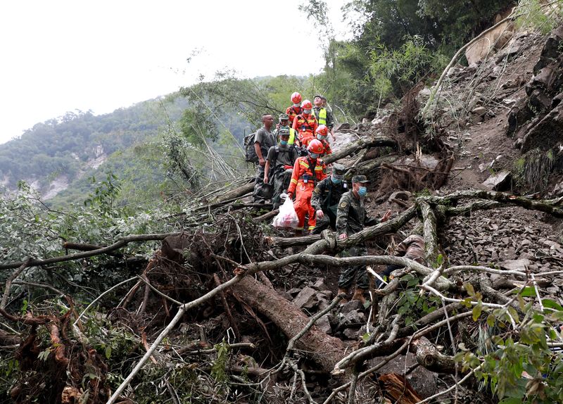 Paramilitary police officers head to Shimian county for search and rescue operations Tuesday following a 6.8 magnitude earthquake, in Yaan, Sichuan province, China. 