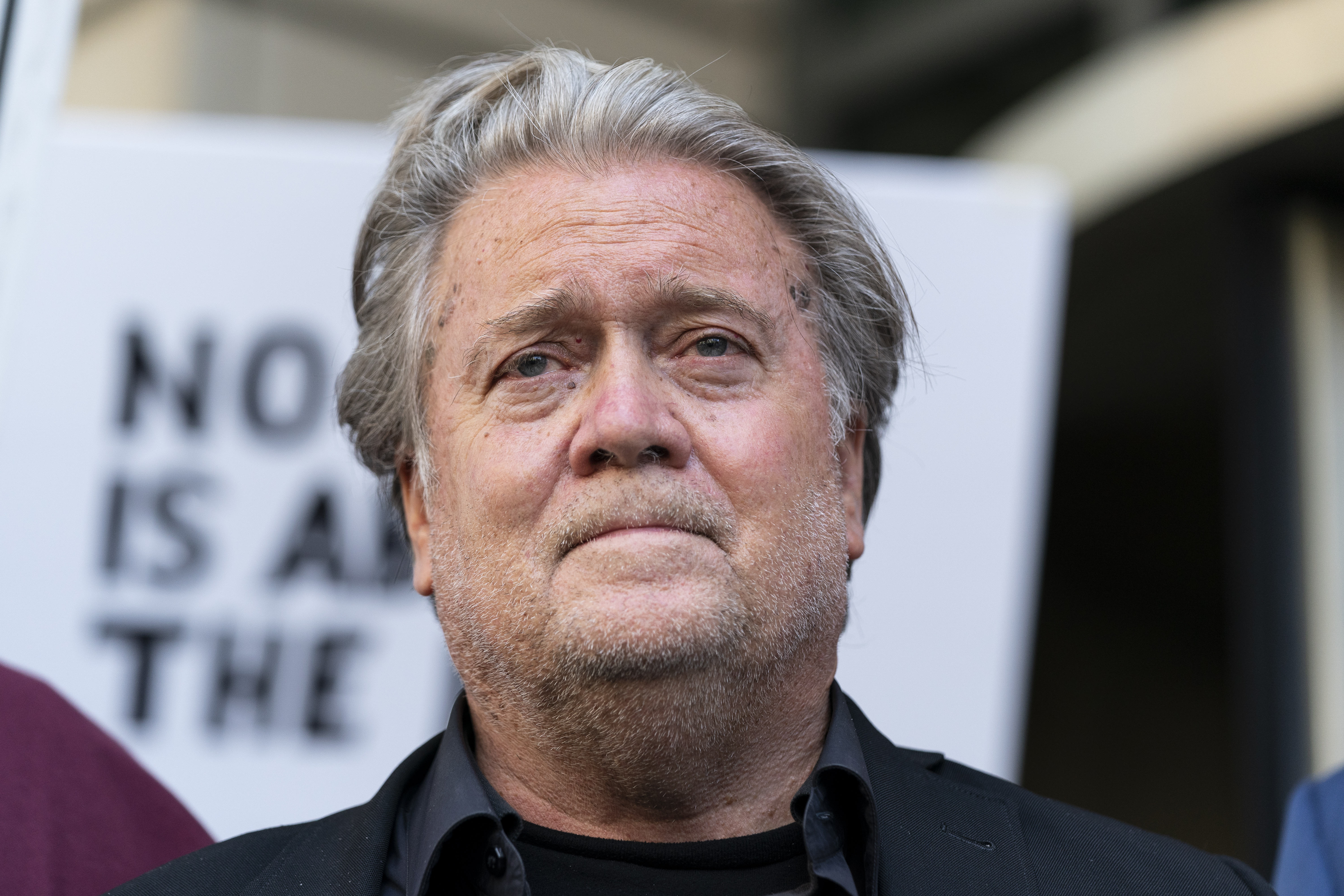 Former White House strategist Steve Bannon pauses as he departs federal court July 22, in Washington. Bannon, a longtime ally of former President Donald Trump, said Tuesday that he expects to be charged soon in a state criminal case in New York. Bannon, 68, plans to turn himself in on Thursday, according to a person familiar with the matter. 