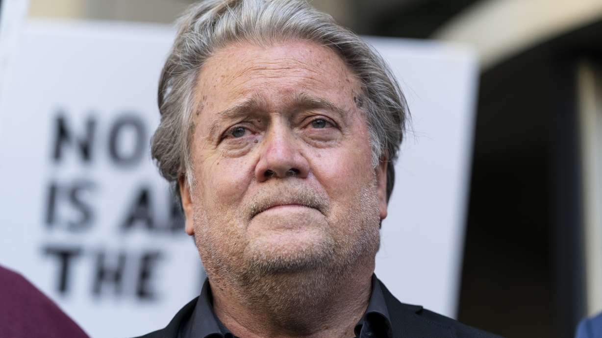 Former White House strategist Steve Bannon pauses as he departs federal court July 22, in Washington. Bannon, a longtime ally of former President Donald Trump, said Tuesday that he expects to be charged soon in a state criminal case in New York. Bannon, 68, plans to turn himself in on Thursday, according to a person familiar with the matter.