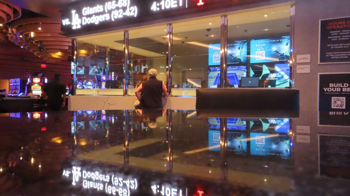 A customer makes a sports bet at the Ocean Casino Resort in Atlantic City, N.J. on Sept. 6, 2022. In the fifth year of legal sports betting in most U.S. states, the action is speeding up due to microbetting, the ability to place a bet on an outcome as narrowly targeted as the result of the next pitch in baseball or the next play in football.