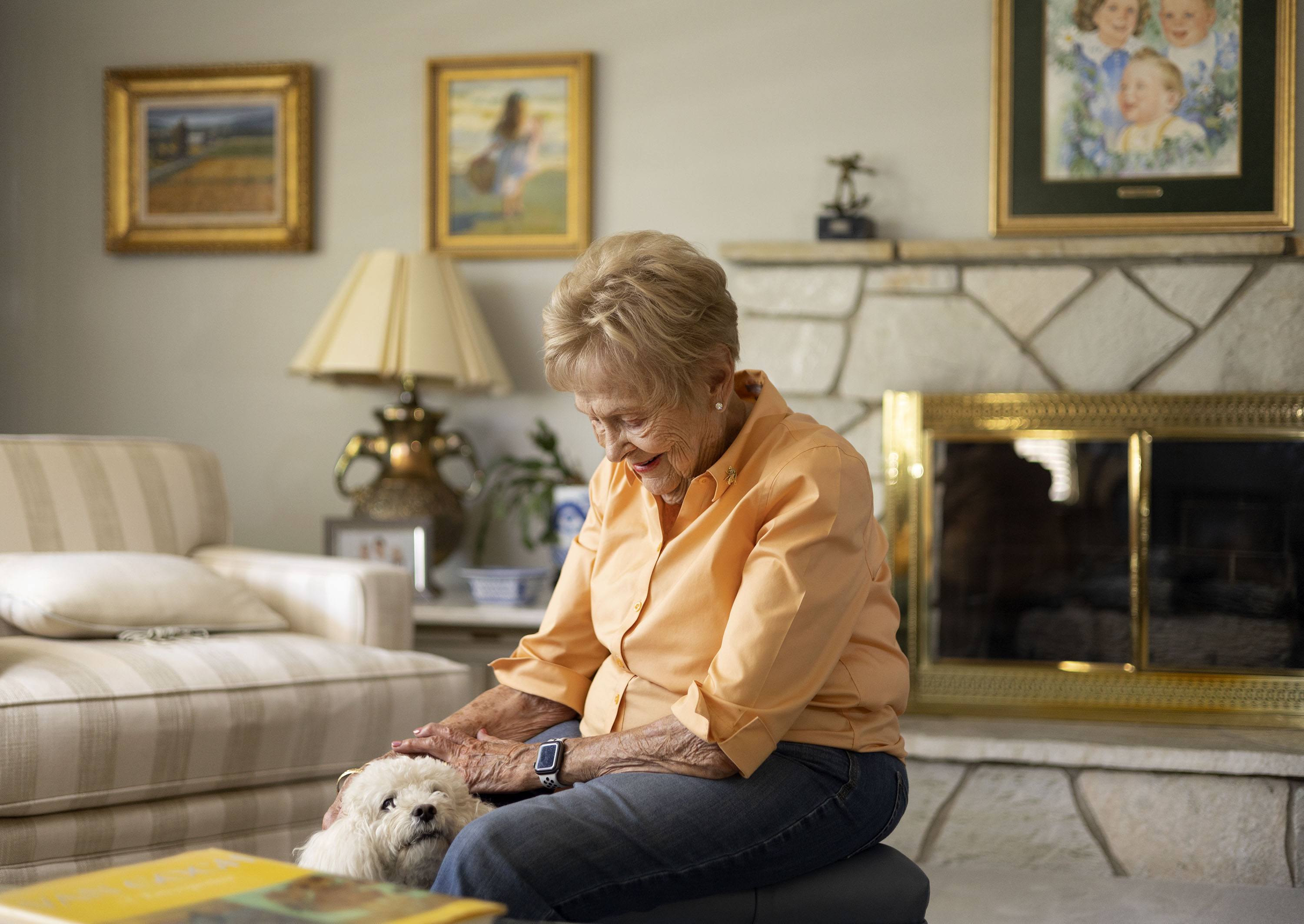 Patti Edwards, wife the late LaVell Edwards, pets her dog, Doodle, at her home in Provo on Thursday, Sept. 1.