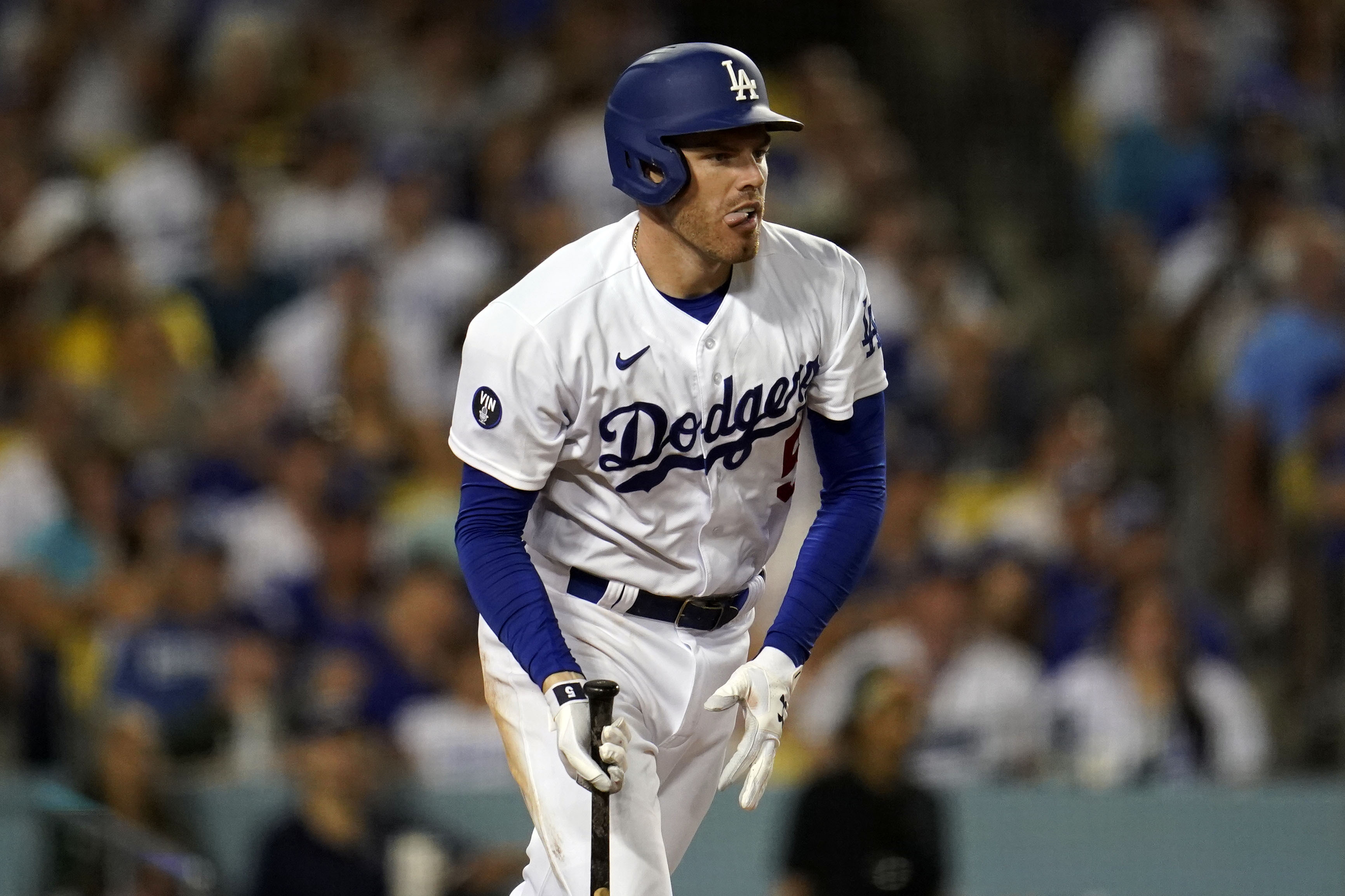 Los Angeles Dodgers' Freddie Freeman reacts after hitting an RBI-single during the sixth inning of a baseball game against the San Diego Padres, Saturday, Sept. 3, 2022, in Los Angeles. 