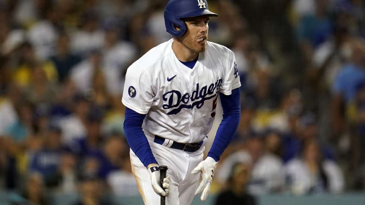 Los Angeles Dodgers' Freddie Freeman reacts after hitting an RBI-single during the sixth inning of a baseball game against the San Diego Padres, Saturday, Sept. 3, 2022, in Los Angeles.