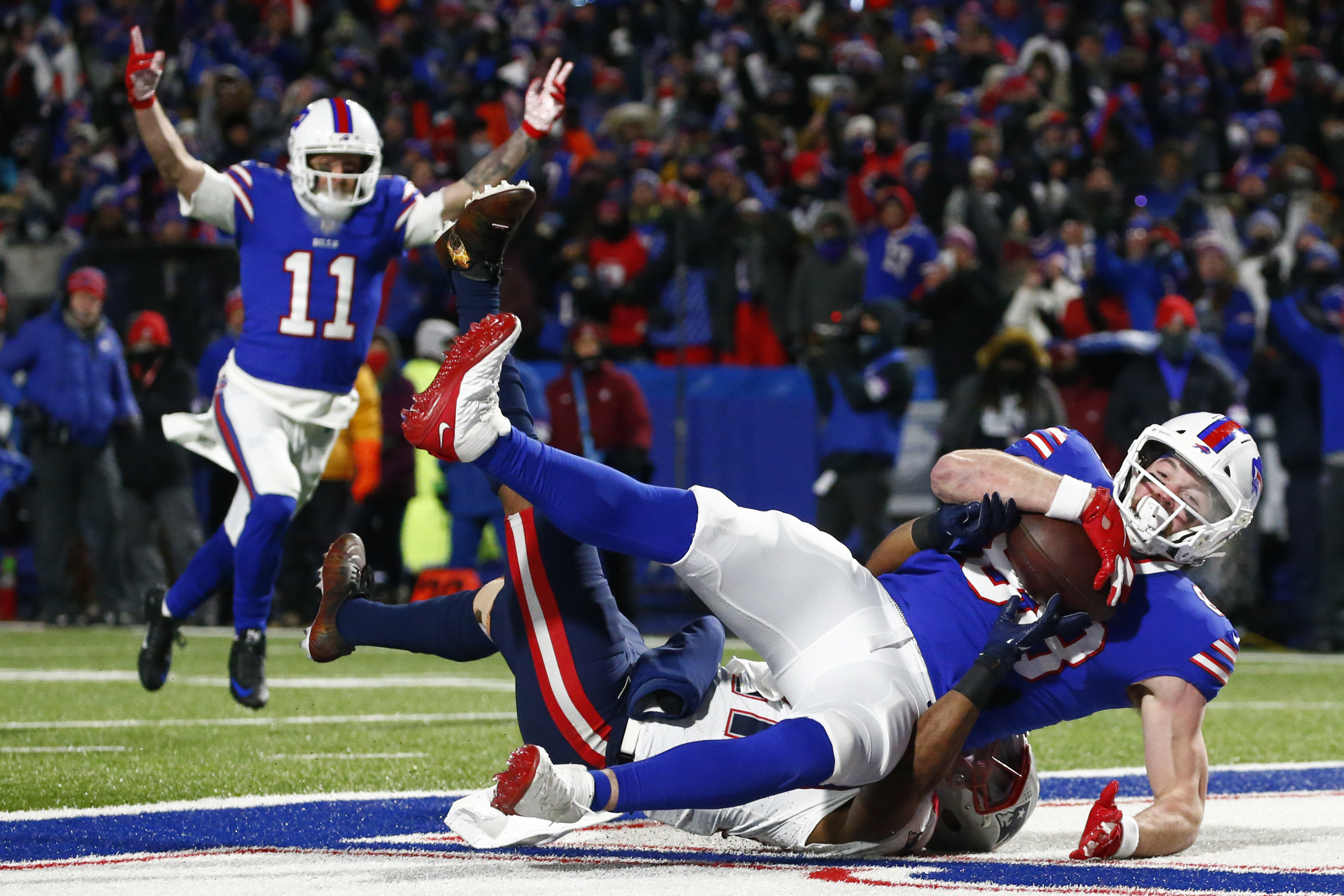 FILE - Buffalo Bills tight end Dawson Knox (88) makes a catch for a touchdown during the first half of an NFL wild-card playoff football game against the New England Patriots in Orchard Park, N.Y., Saturday, Jan. 15, 2022. The Bills signed tight end Dawson Knox to a four-year contract extension in a move made on Wednesday, Sept. 7, 2022, that locks up one of the team's top scoring threats.