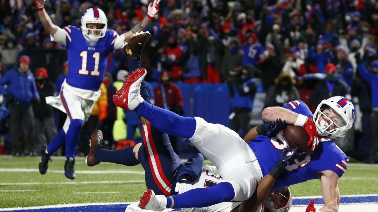 FILE - Buffalo Bills tight end Dawson Knox (88) makes a catch for a touchdown during the first half of an NFL wild-card playoff football game against the New England Patriots in Orchard Park, N.Y., Saturday, Jan. 15, 2022. The Bills signed tight end Dawson Knox to a four-year contract extension in a move made on Wednesday, Sept. 7, 2022, that locks up one of the team's top scoring threats.