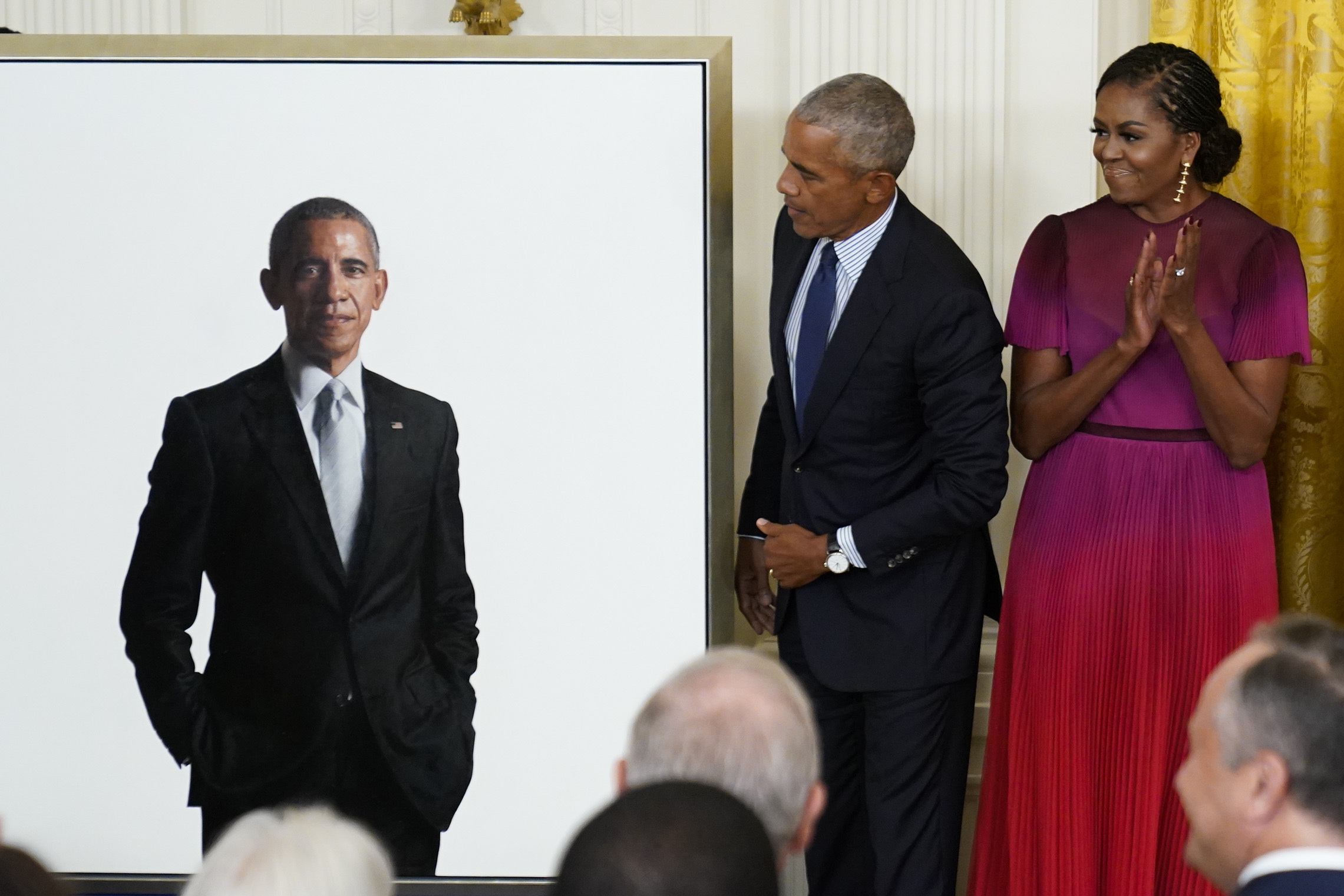 Former President Barack Obama looks at his official White House portrait with former first lady Michelle Obama during a ceremony in the East Room of the White House, Wednesday, in Washington.