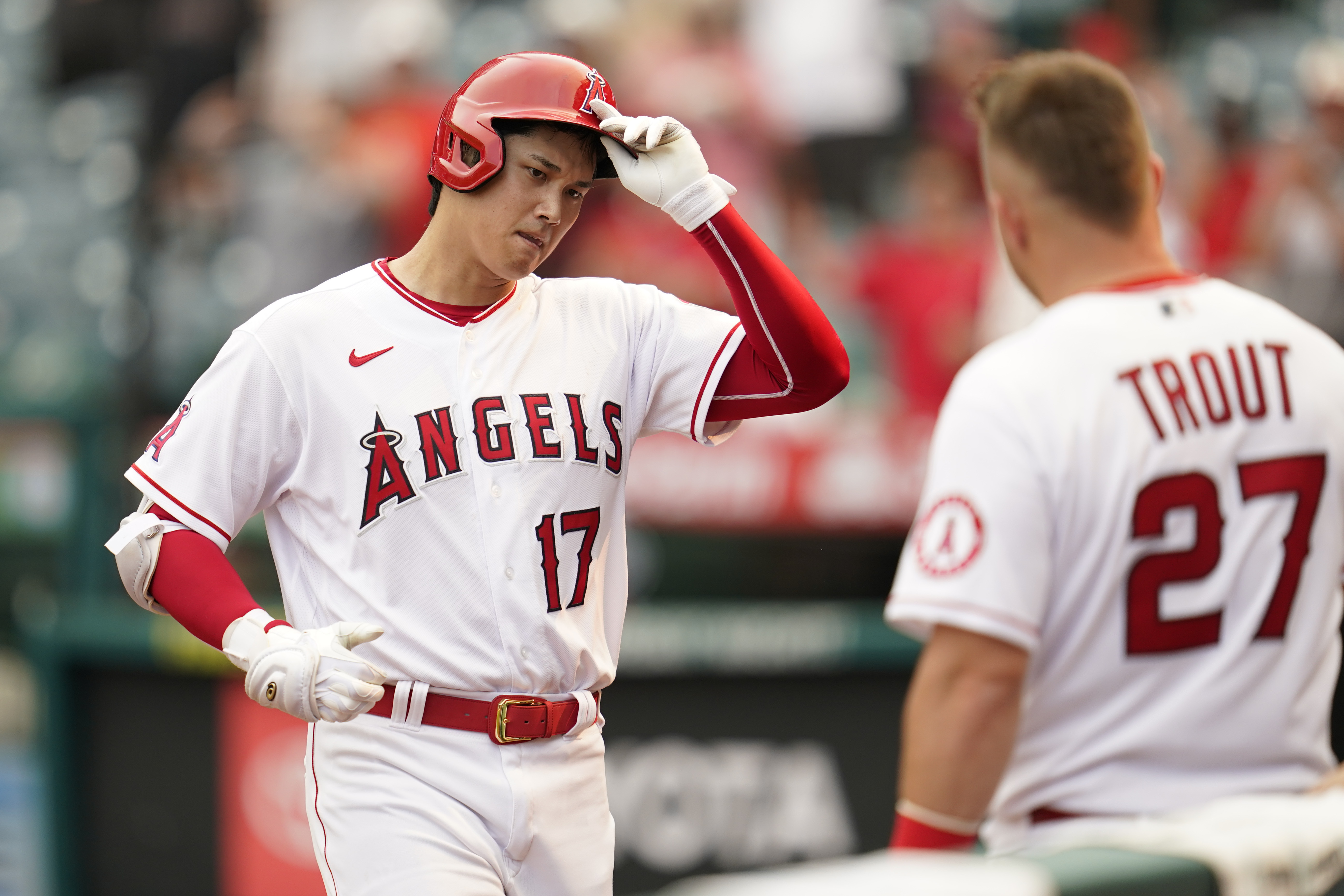 Los Angeles Angels designated hitter Shohei Ohtani (17) is greeted by Mike Trout (27) after hitting a home run during the seventh inning of a baseball game against the Detroit Tigers in Anaheim, Calif., Wednesday, Sept. 7, 2022. 