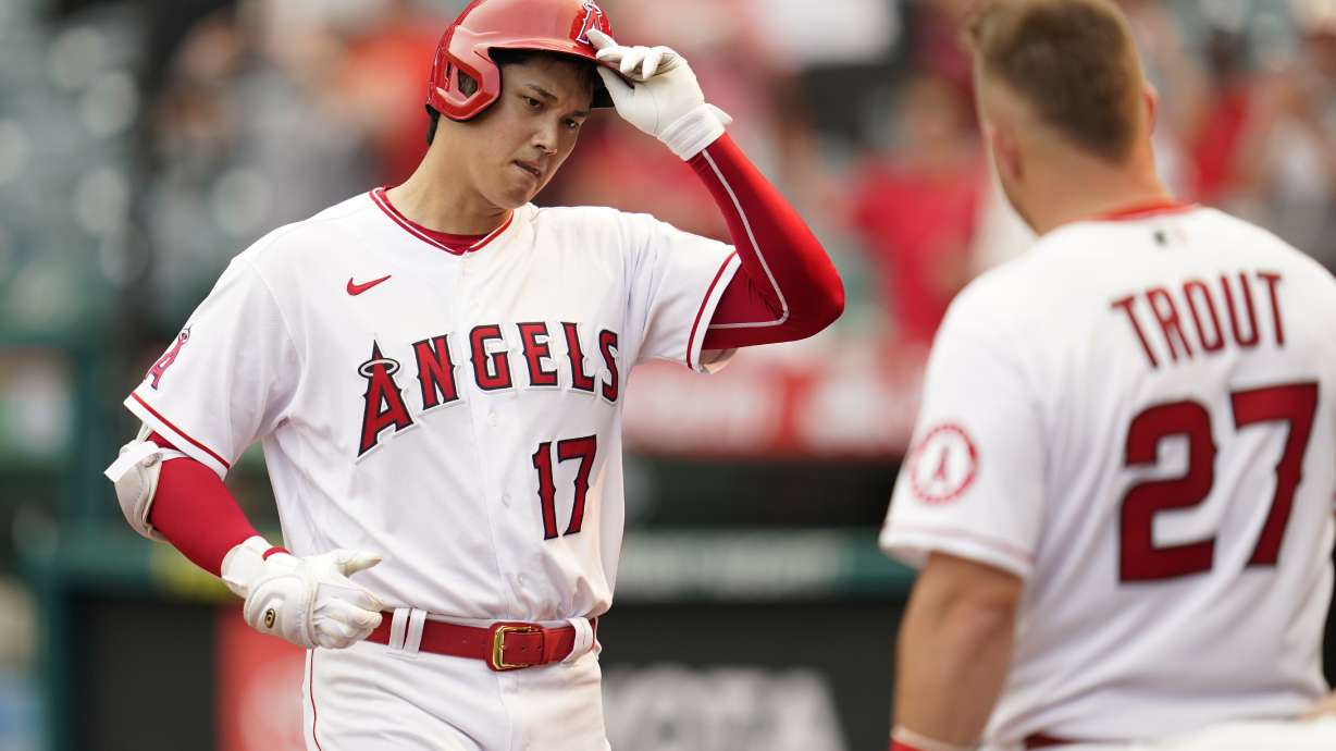 Los Angeles Angels designated hitter Shohei Ohtani (17) is greeted by Mike Trout (27) after hitting a home run during the seventh inning of a baseball game against the Detroit Tigers in Anaheim, Calif., Wednesday, Sept. 7, 2022.