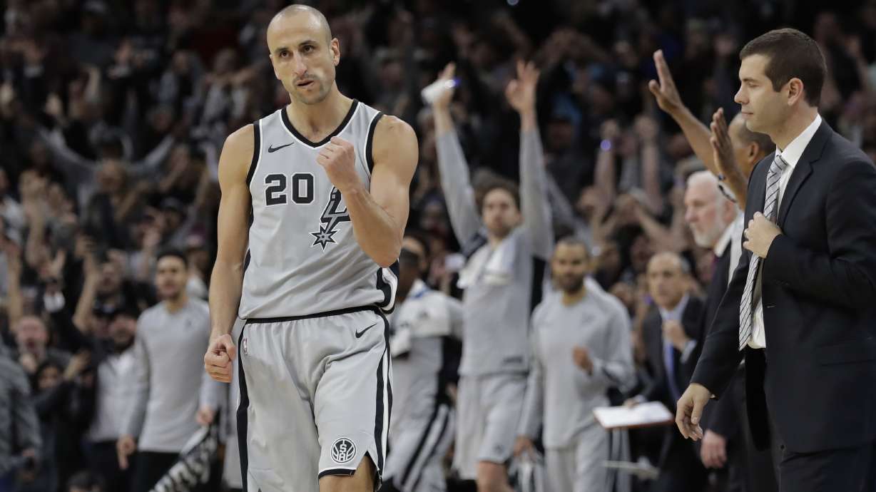 FILE - San Antonio Spurs guard Manu Ginobili (20) pumps his fist after hitting the winning shot in the final seconds of the team's NBA basketball game against the Boston Celtics, Friday, Dec. 8, 2017, in San Antonio. The four-time NBA champion with the San Antonio Spurs is one of the headliners for Saturday night’s enshrinement ceremony in Springfield, Massachusetts.